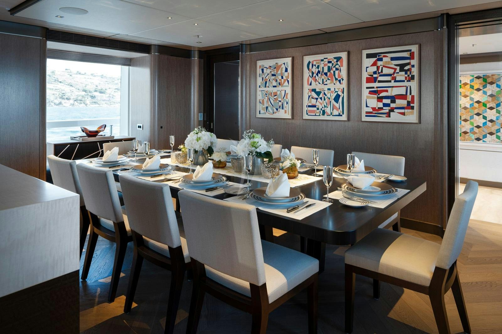 a dining room with tables and chairs aboard MOSKITO Yacht for Charter
