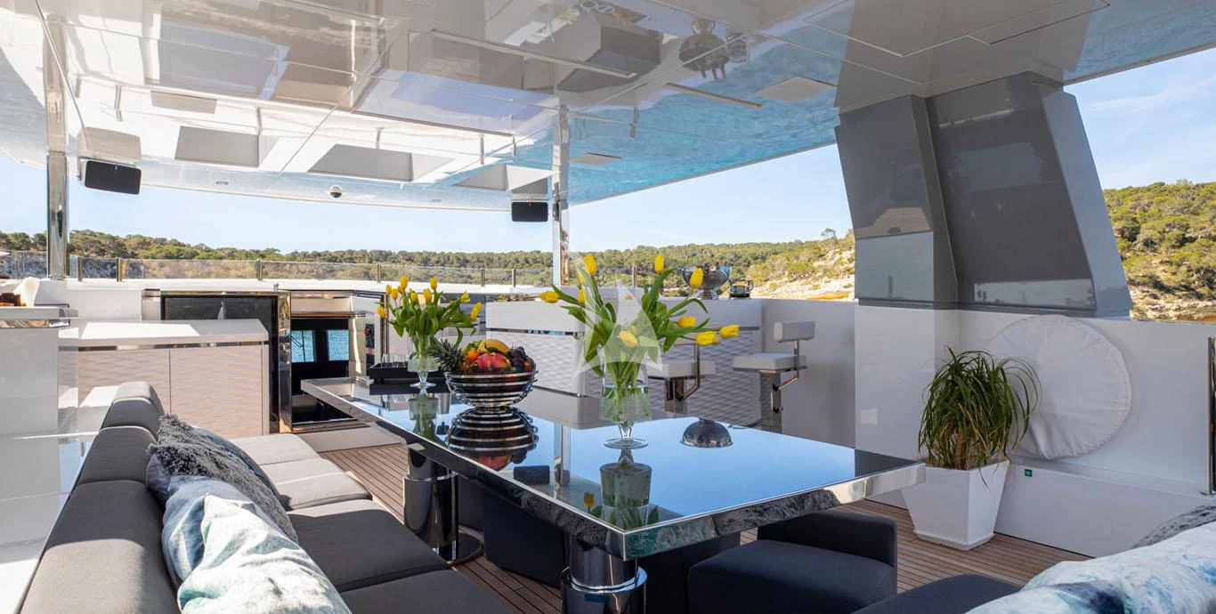 a room with a table and chairs aboard CINQUANTA-50 Yacht for Charter