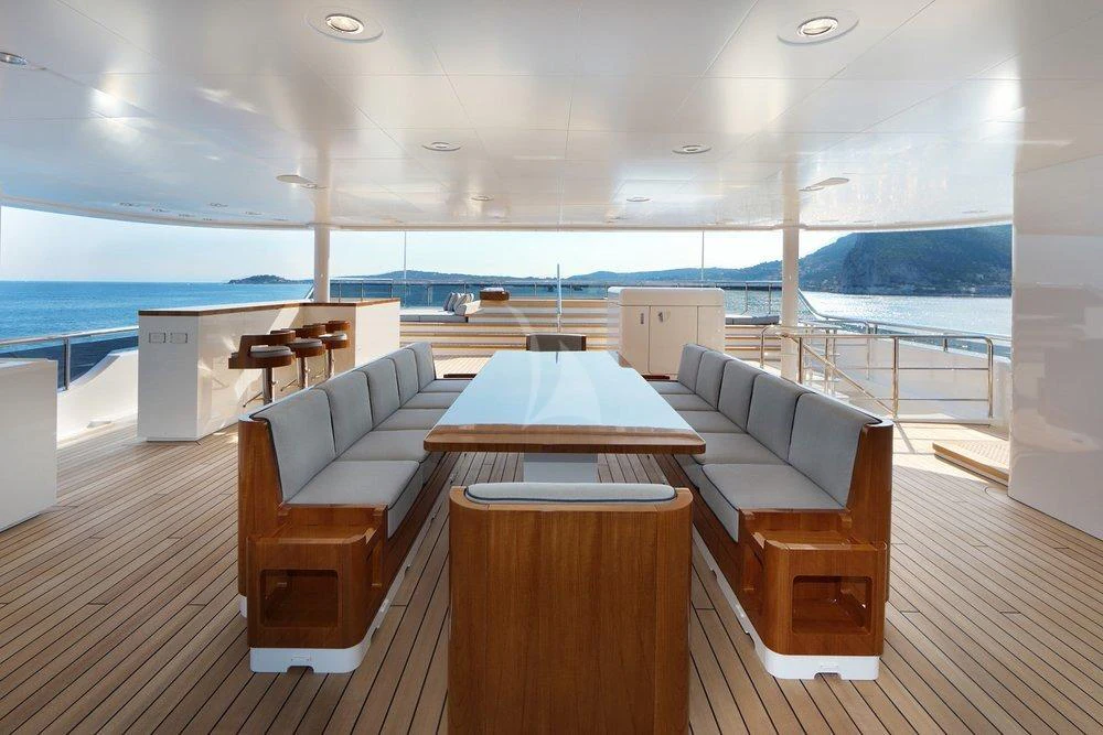 a room with a table and chairs aboard PLANET NINE Yacht for Charter