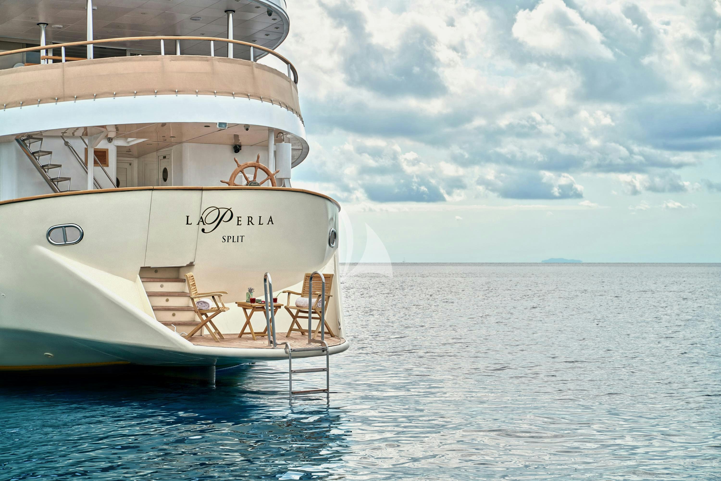 a white boat in the water aboard LA PERLA Yacht for Charter