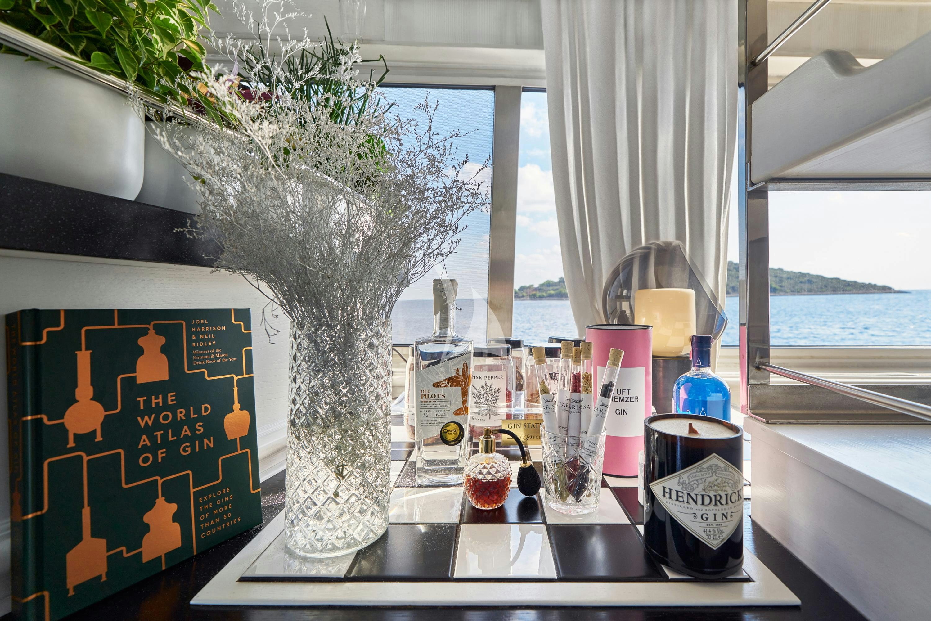 a table with a vase and candles aboard LA PERLA Yacht for Charter