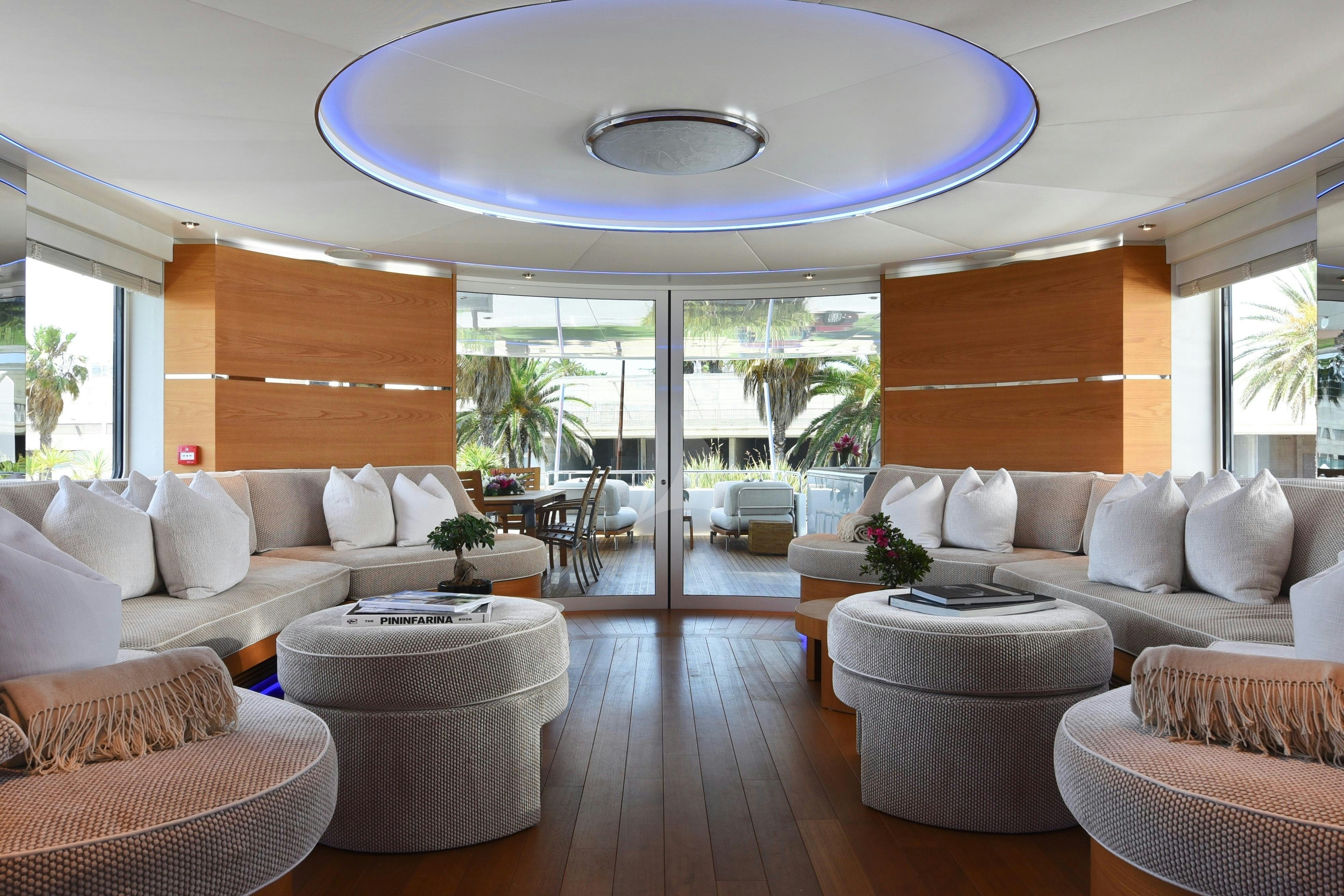 a living room with a large window aboard LIFE SAGA Yacht for Charter