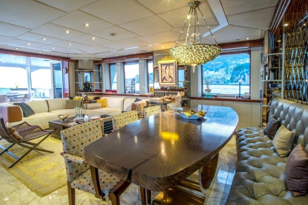 a living room with a table and chairs aboard ZULU Yacht for Charter