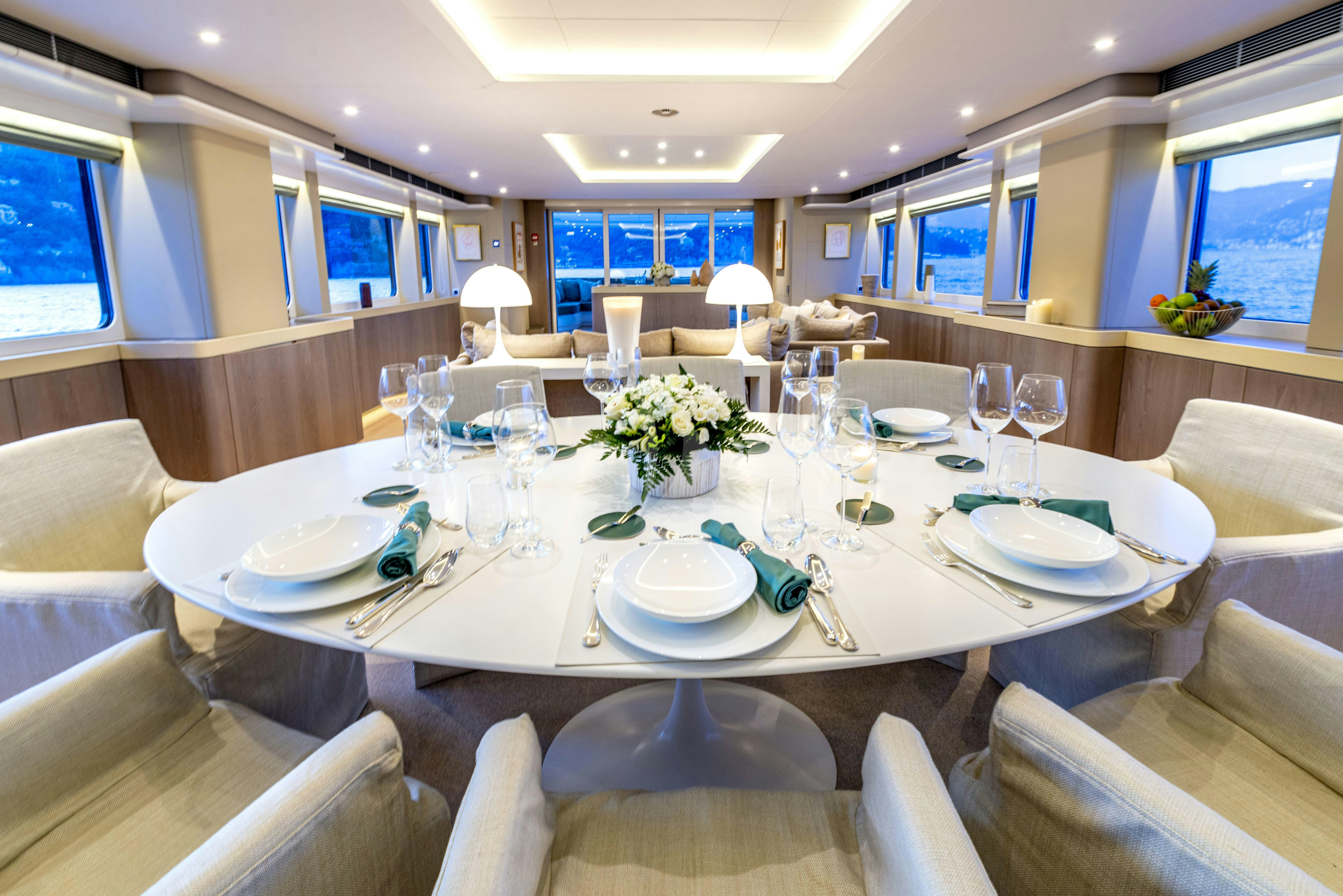 a table set for a dinner aboard UNEXPECTED Yacht for Charter