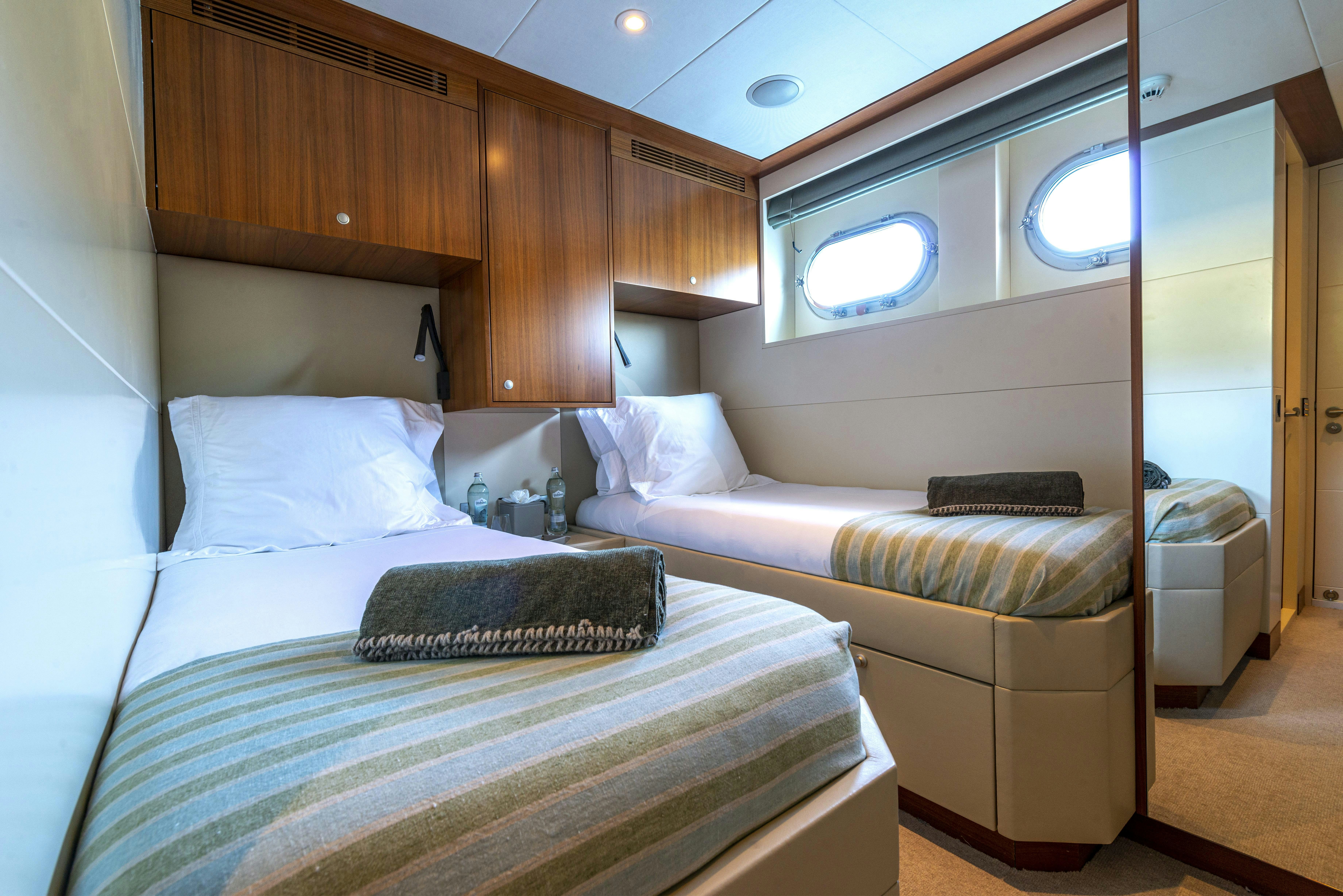 a room with two beds aboard UNEXPECTED Yacht for Charter