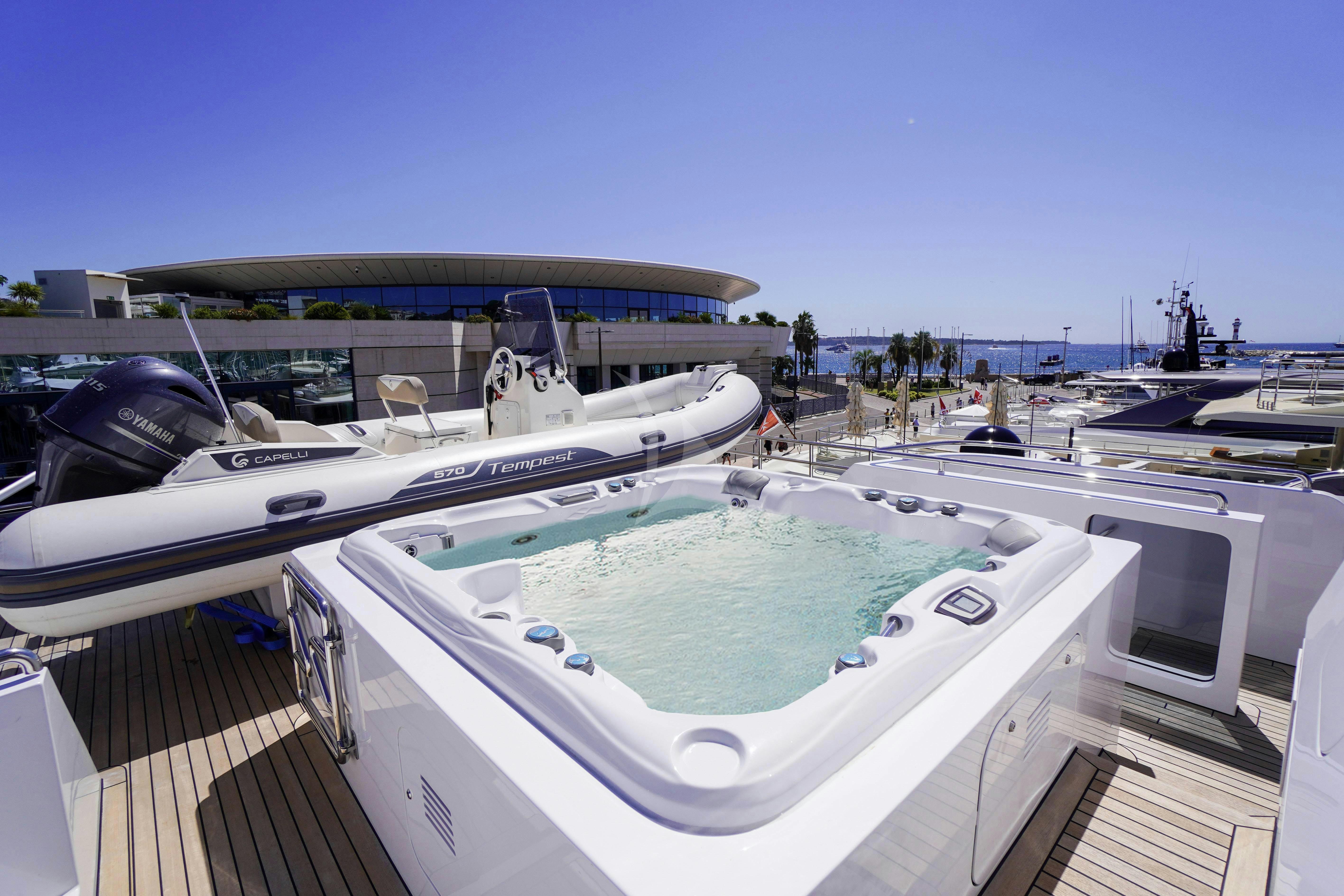 a large white boat on a dock aboard UNEXPECTED Yacht for Charter