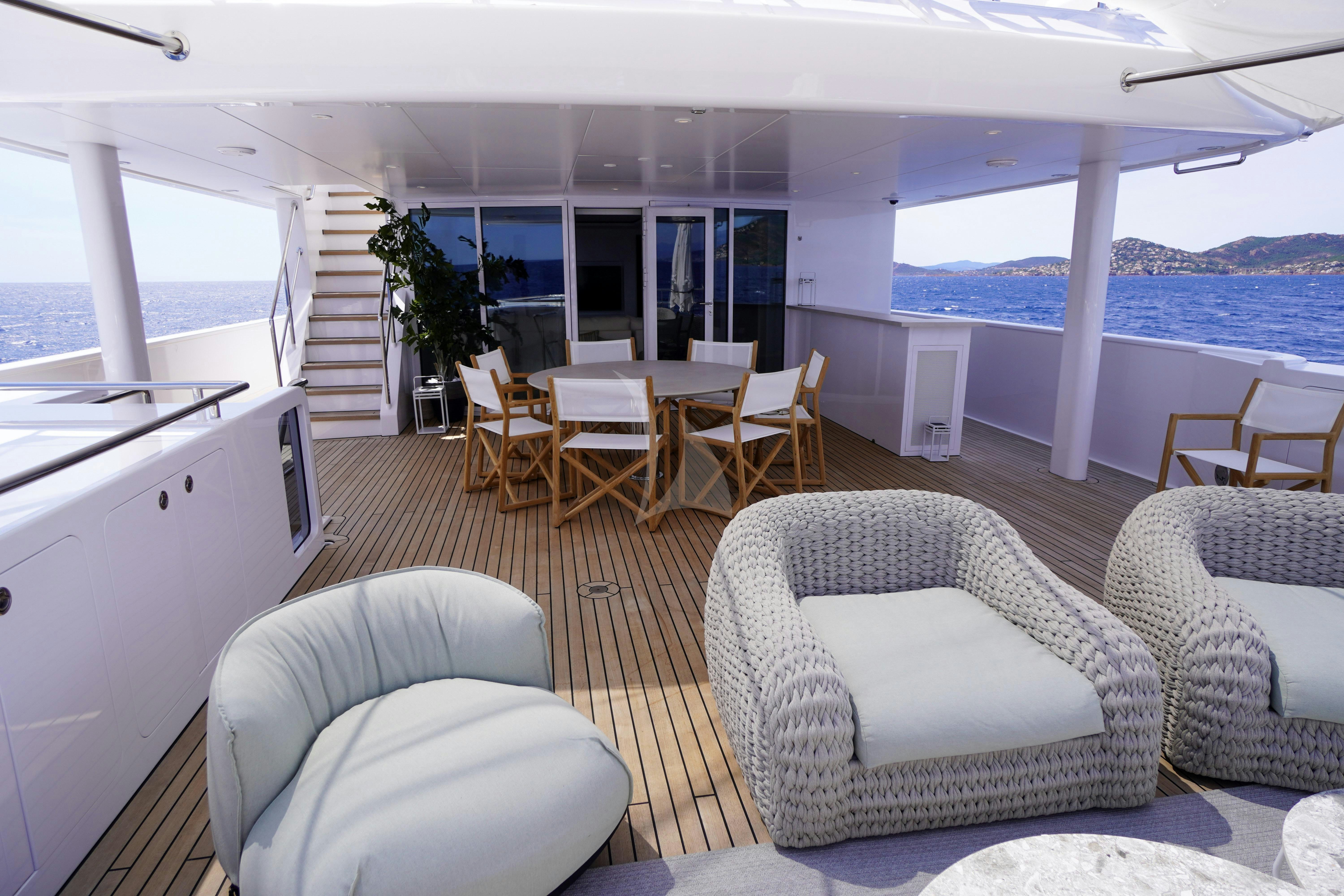 a living room with a large window aboard UNEXPECTED Yacht for Charter