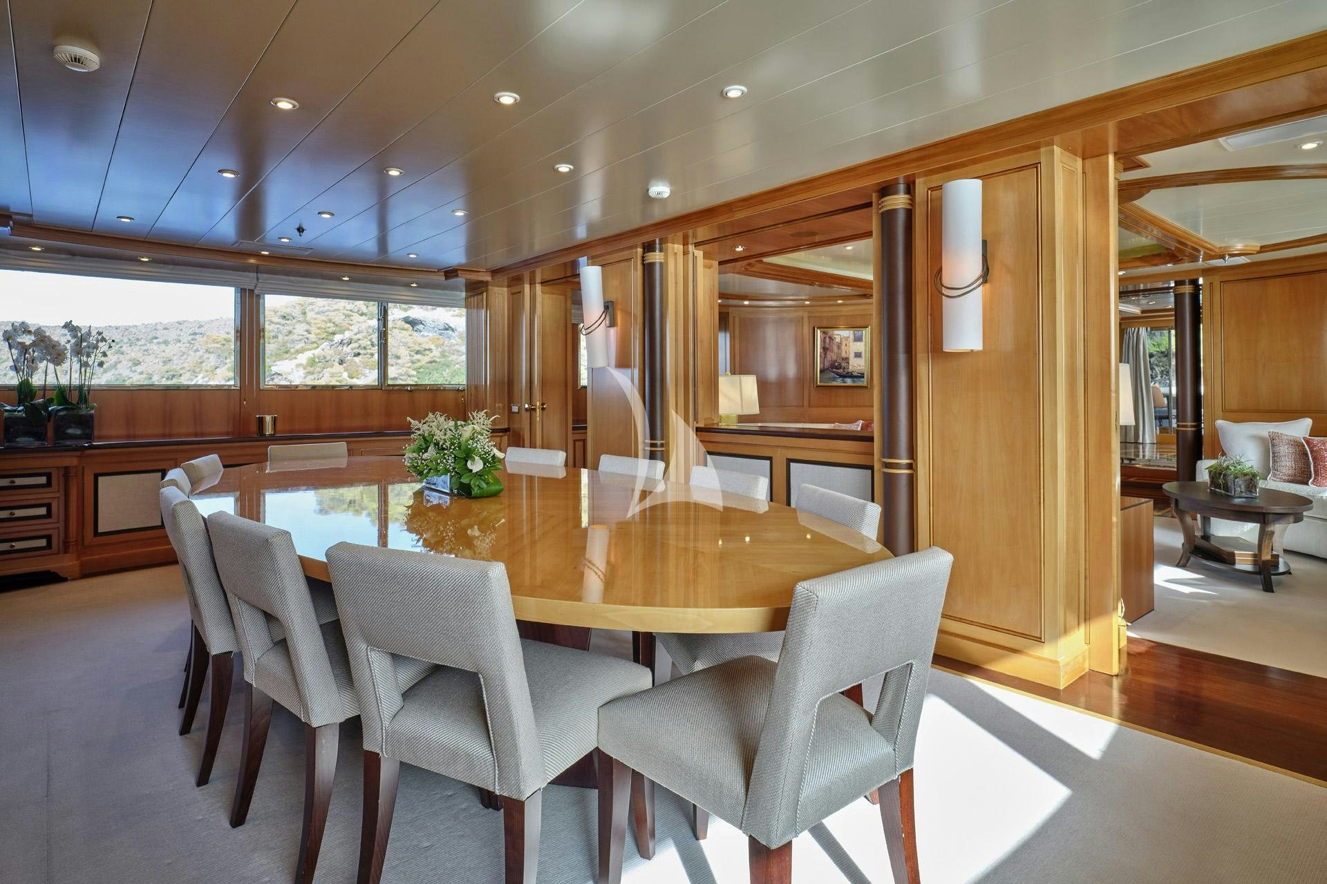 a large kitchen with a dining table aboard ELENA V Yacht for Charter