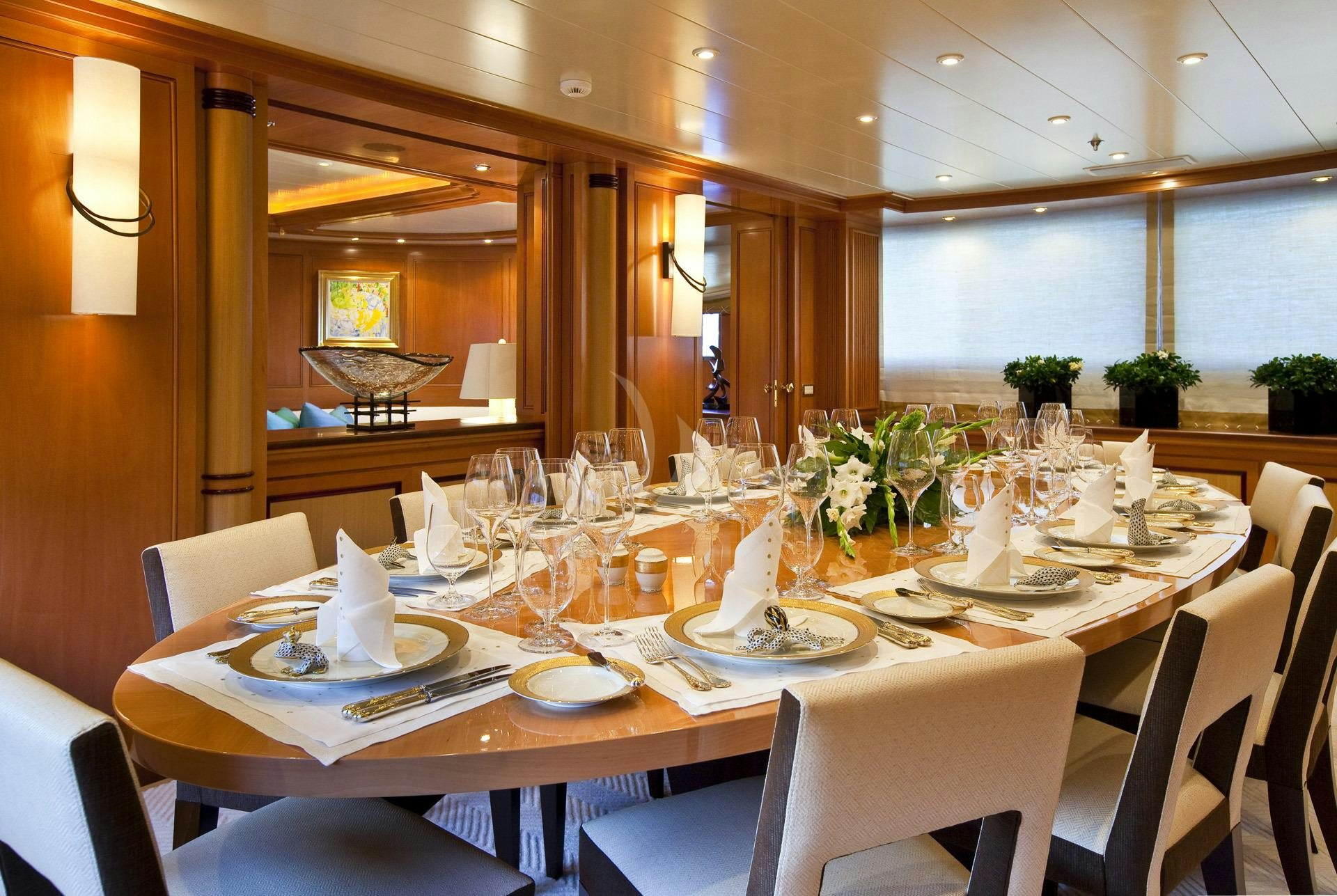 a table set for a formal dinner aboard ELENA V Yacht for Charter