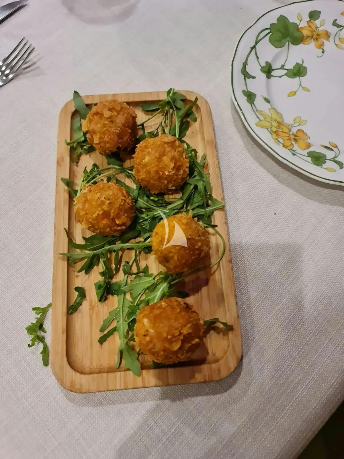 a plate of food aboard QUARTA SANTA MARIA Yacht for Sale