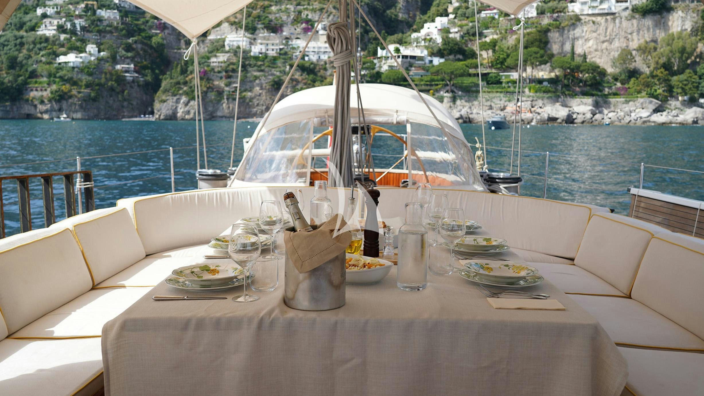 a table with food on it aboard QUARTA SANTA MARIA Yacht for Sale