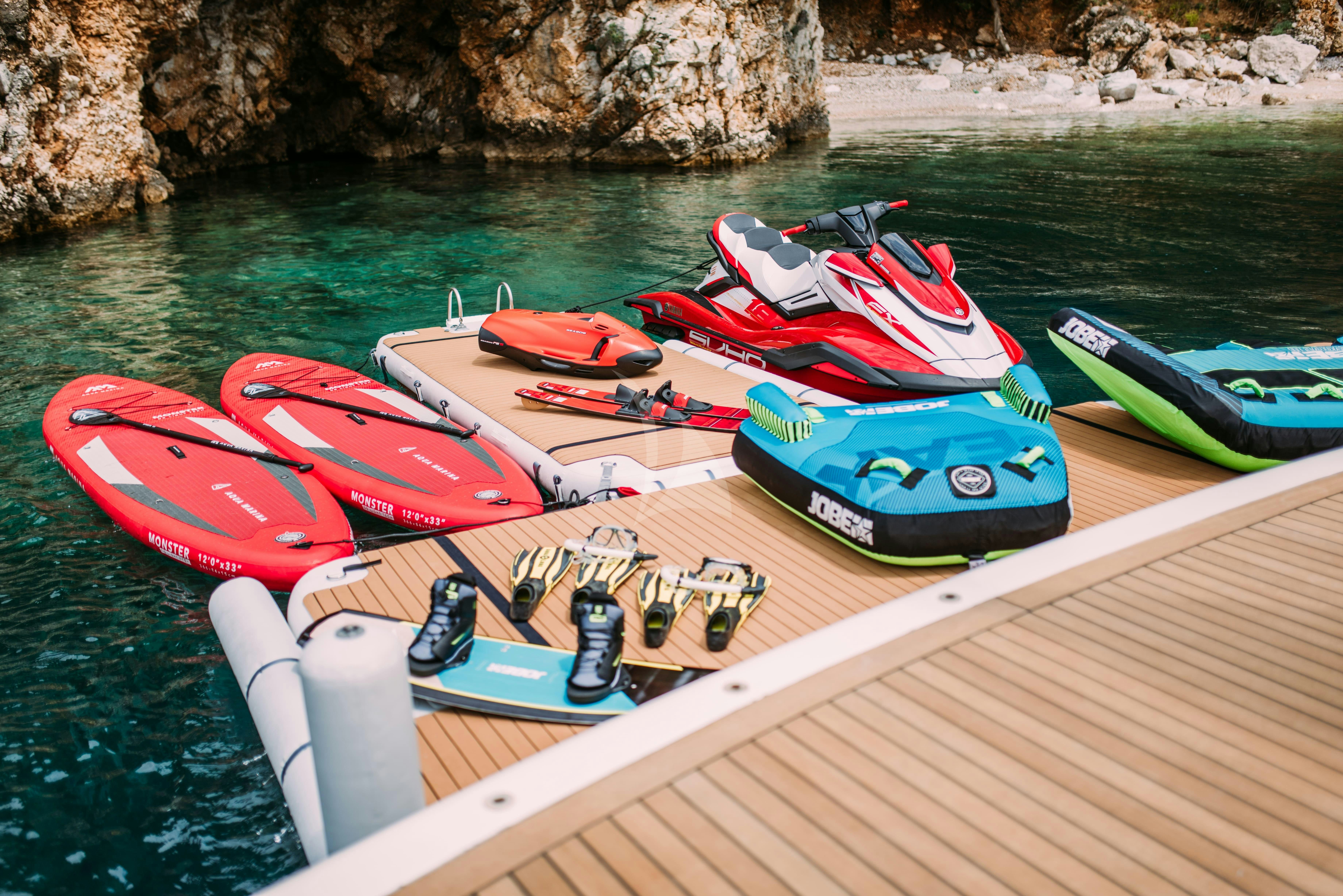 a group of kayaks on a boat aboard TIREA Yacht for Charter