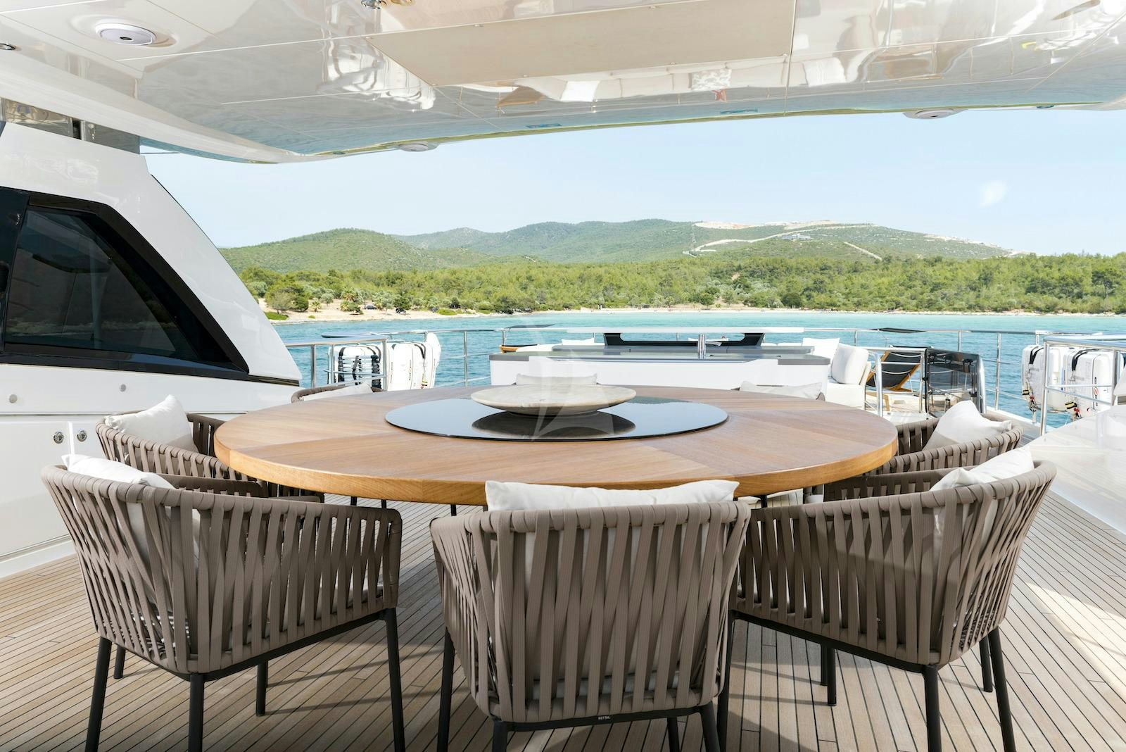 a table on a deck aboard ANTHEYA III Yacht for Charter