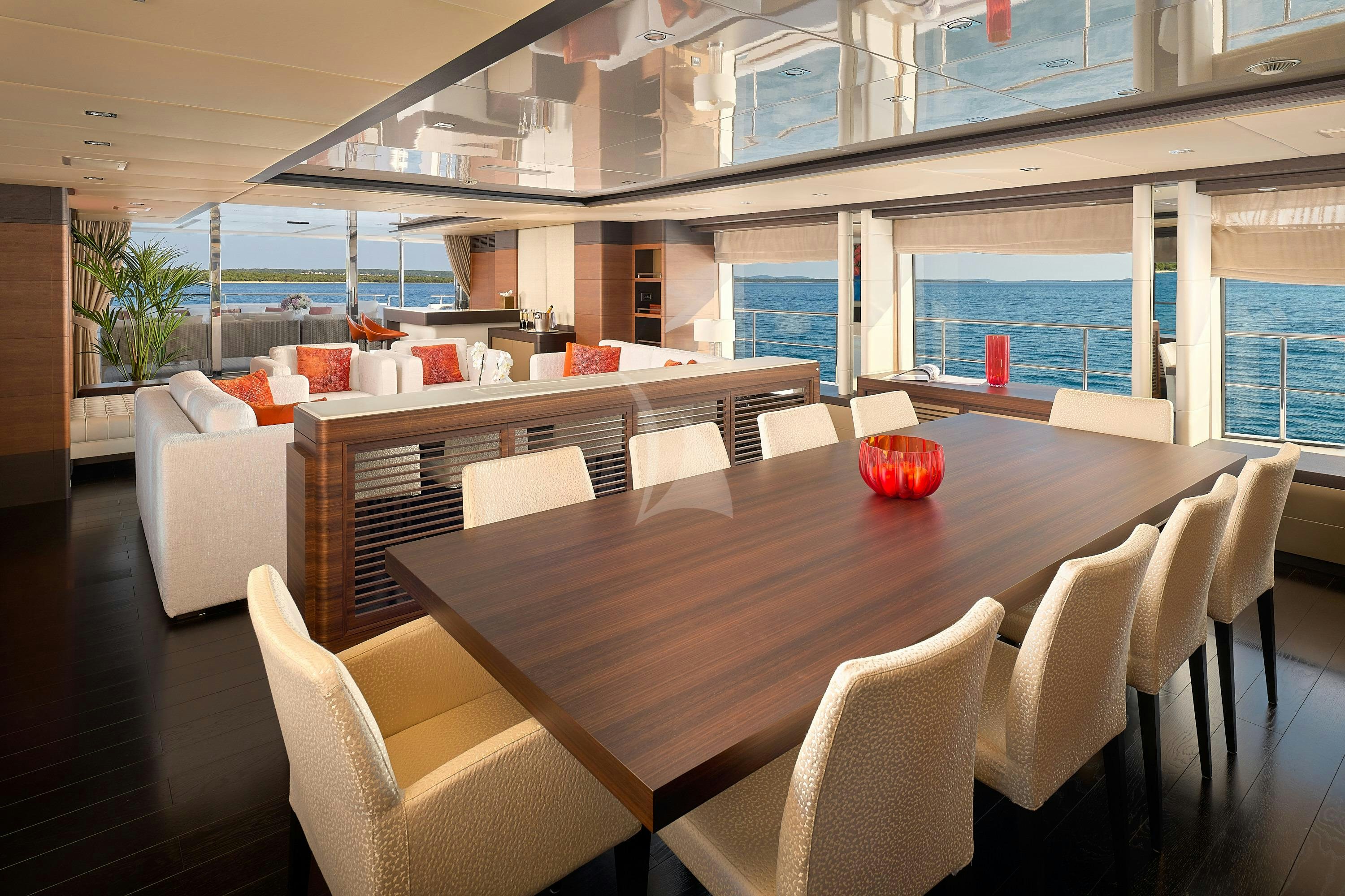 a large table with chairs around it aboard LADY MRD Yacht for Charter