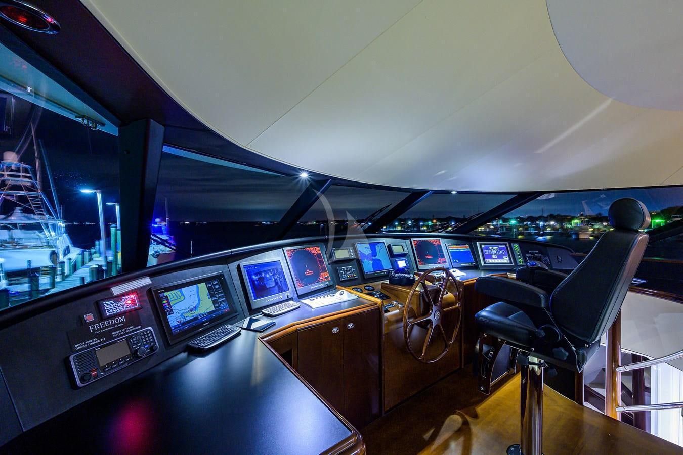 inside of a vehicle with many screens aboard UNWINED Yacht for Charter