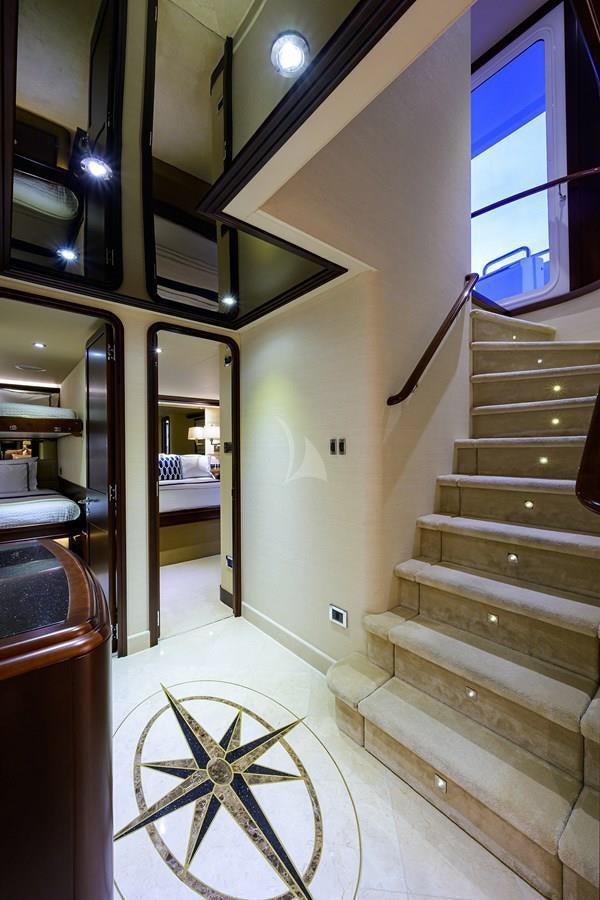 a staircase with a bicycle aboard UNWINED Yacht for Charter