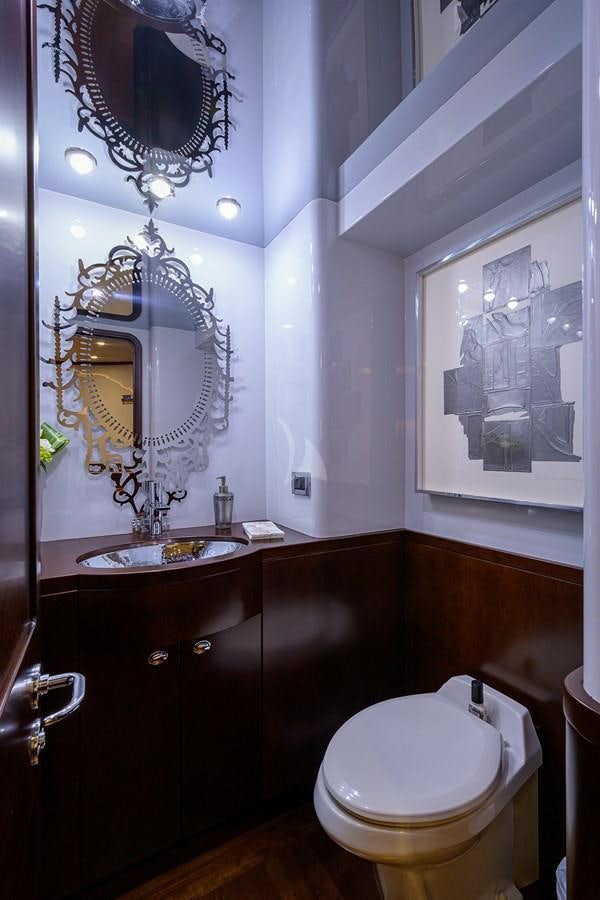 a bathroom with a sink and a mirror aboard UNWINED Yacht for Charter