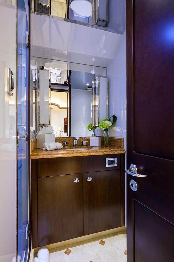 a bathroom with a sink and cabinets aboard UNWINED Yacht for Charter