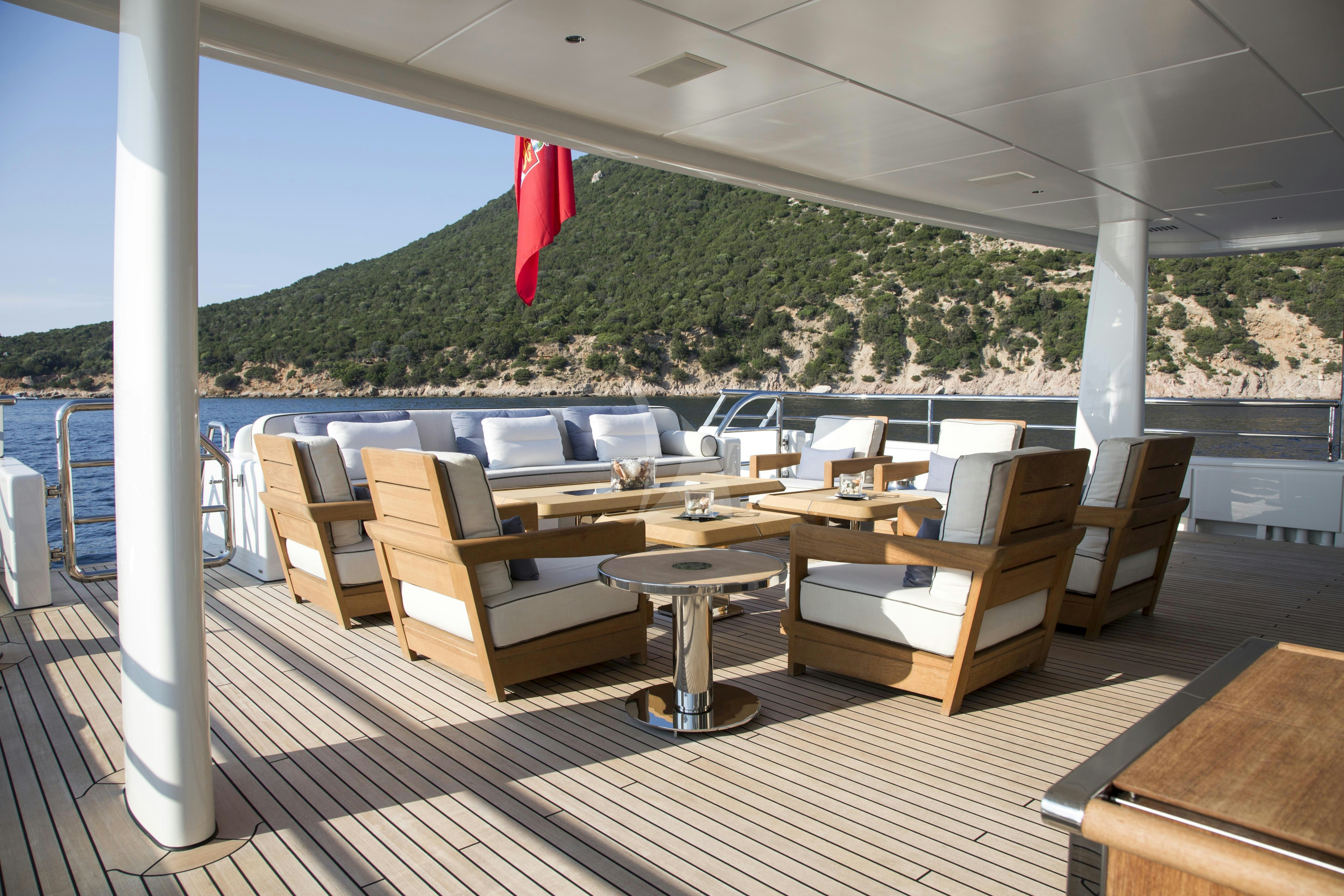 a room with a table and chairs aboard KAMALAYA Yacht for Charter