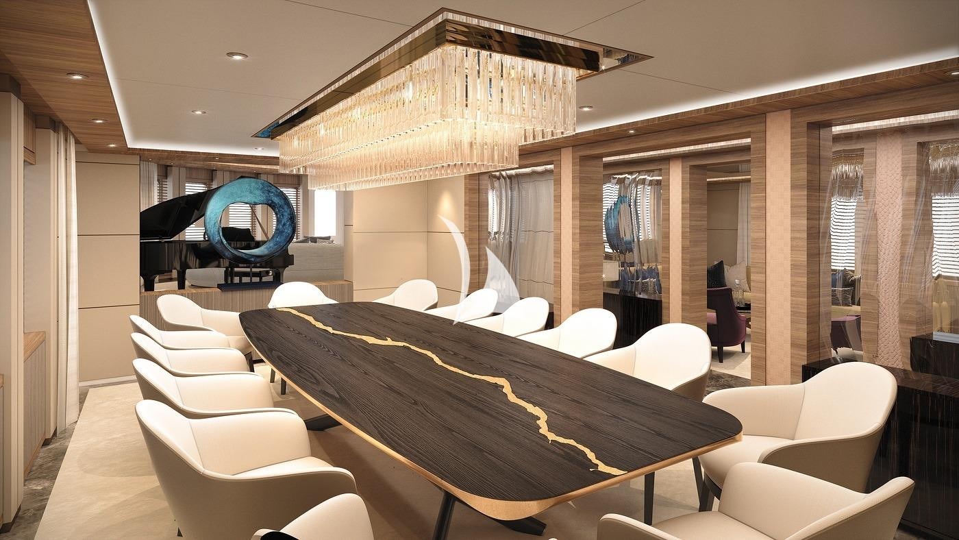 a large room with chairs and a table with a large umbrella aboard VICTORIOUS Yacht for Sale