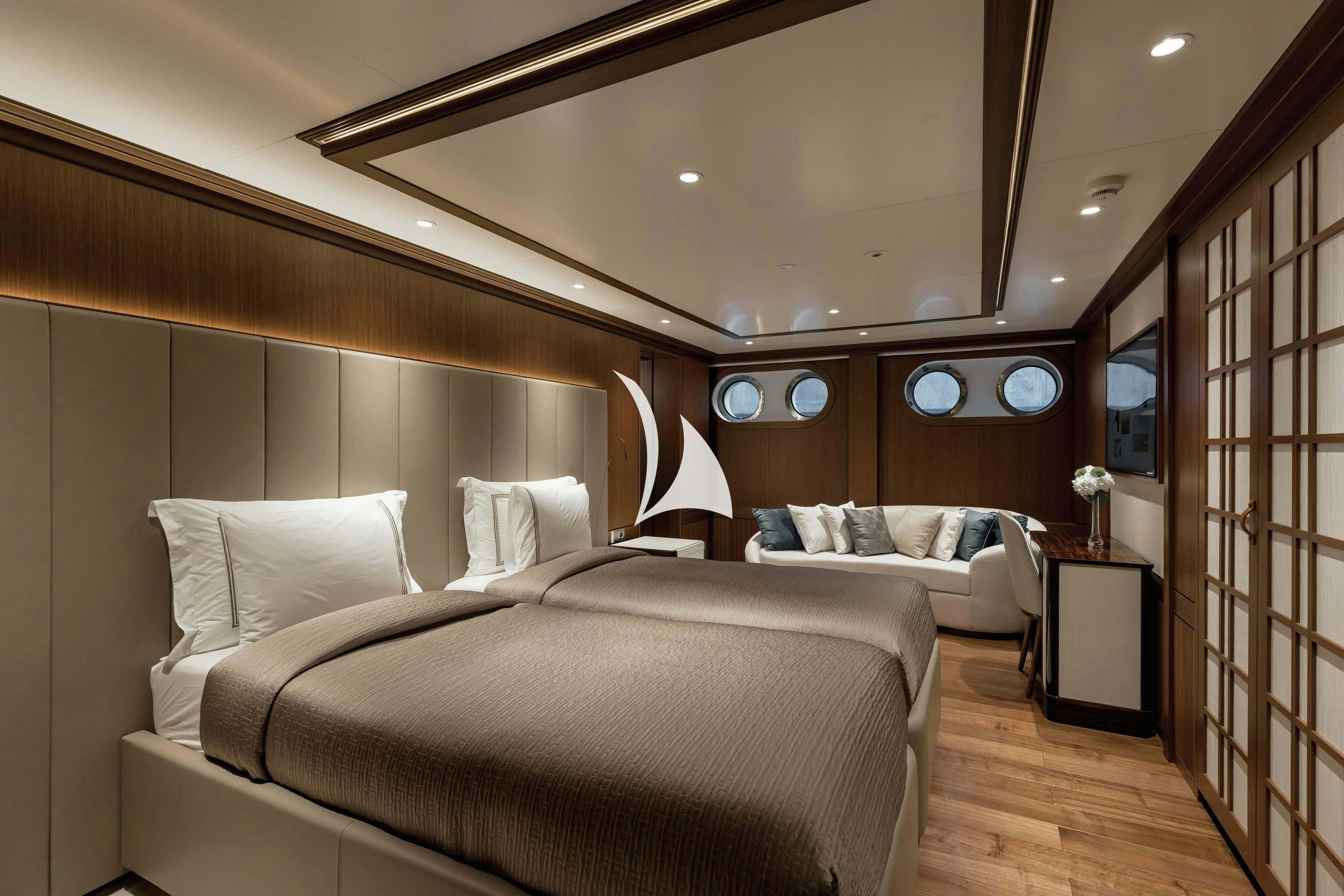 a room with two beds aboard VICTORIOUS Yacht for Sale