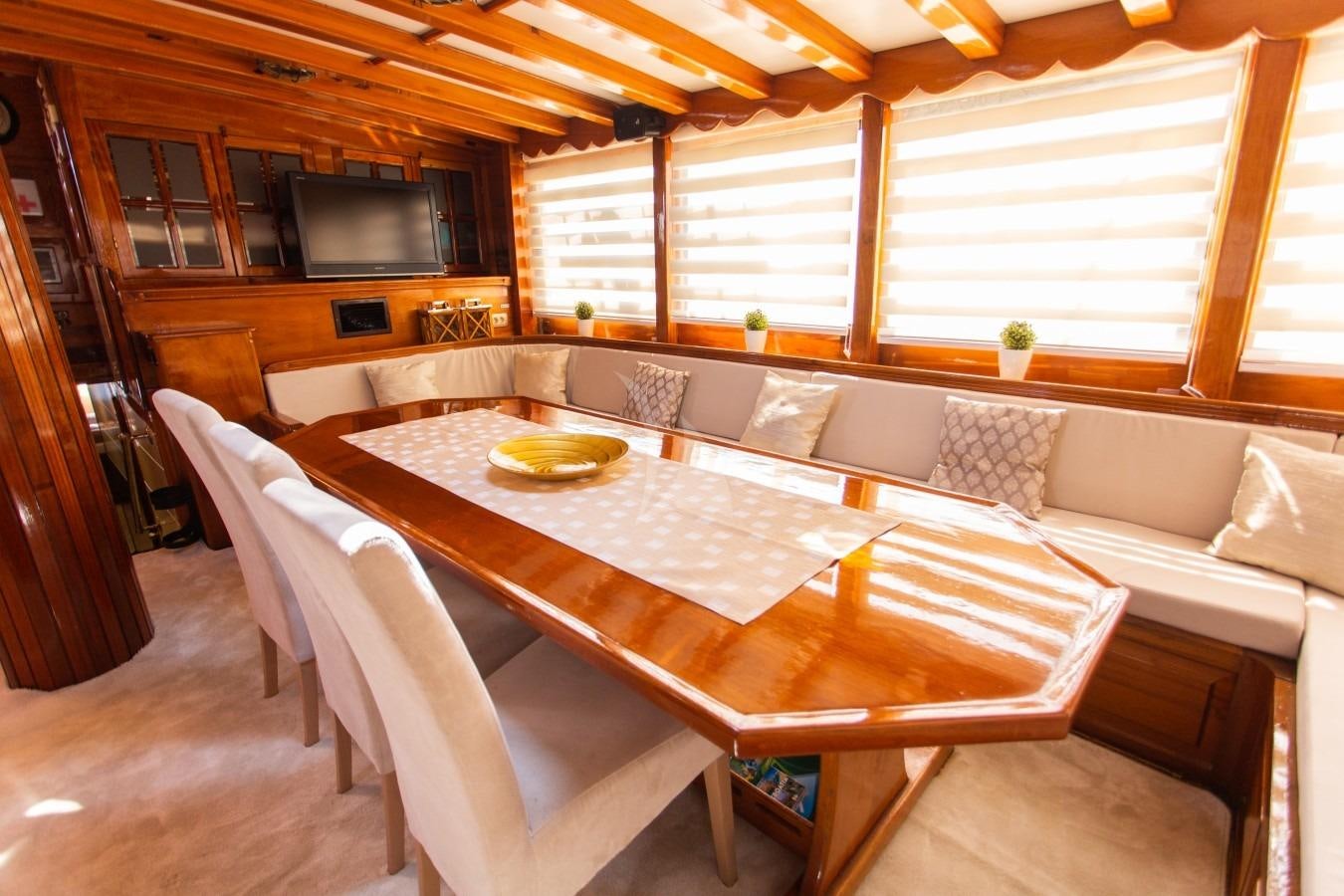 a dining table in a cabin aboard KADENA Yacht for Charter