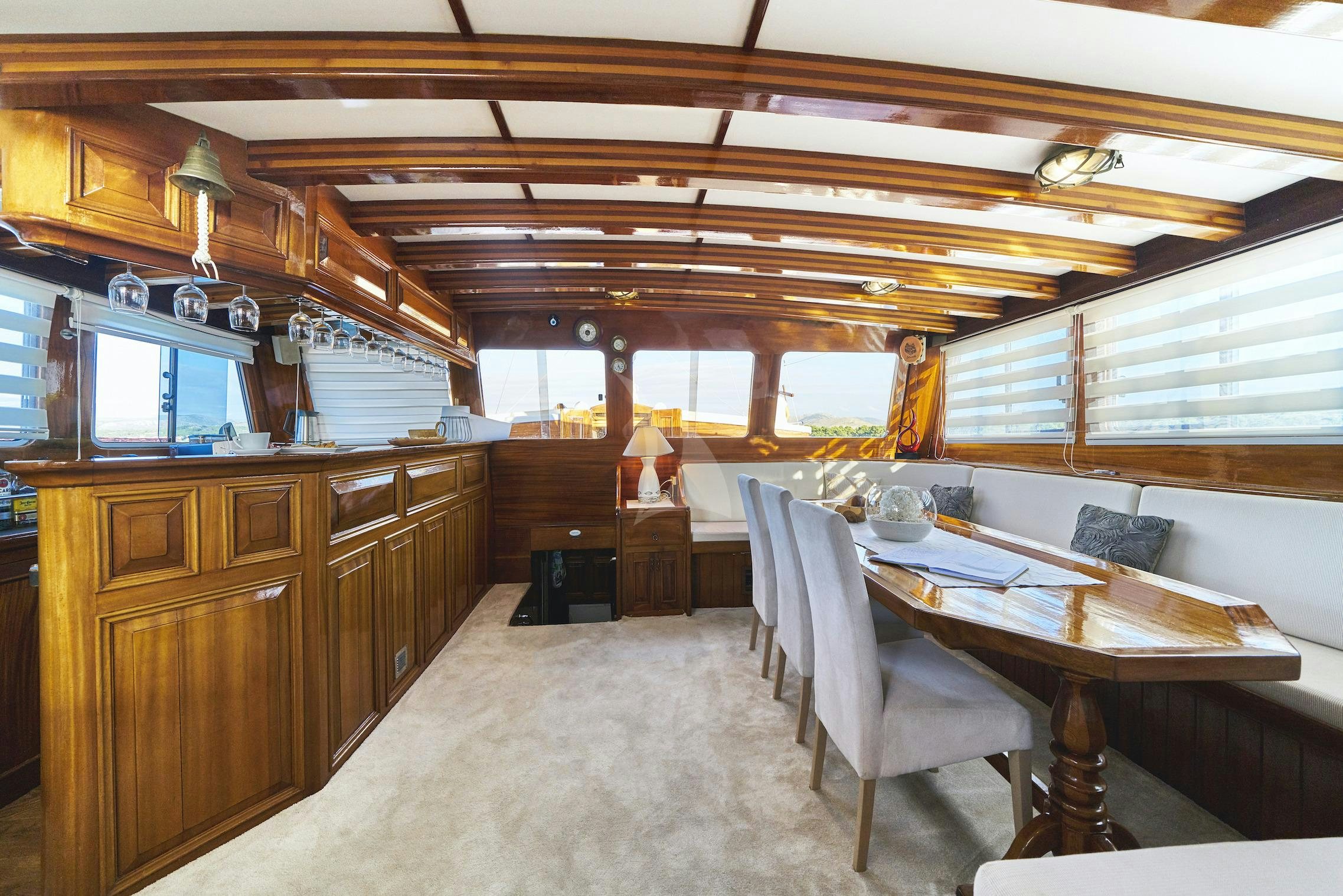a large kitchen with a large table aboard PERLA Yacht for Charter