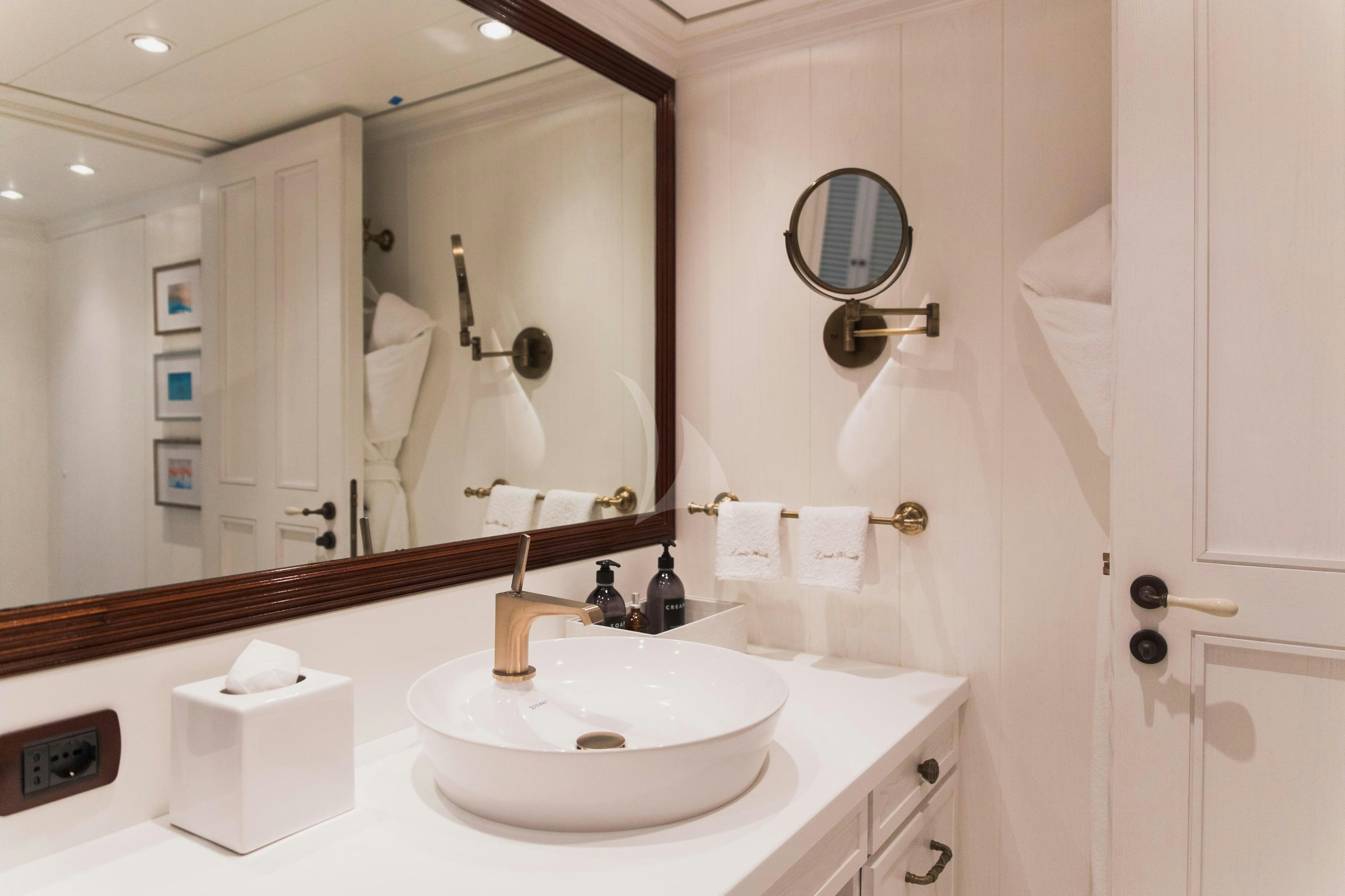 a bathroom with a large mirror aboard LADY TRUDY Yacht for Charter