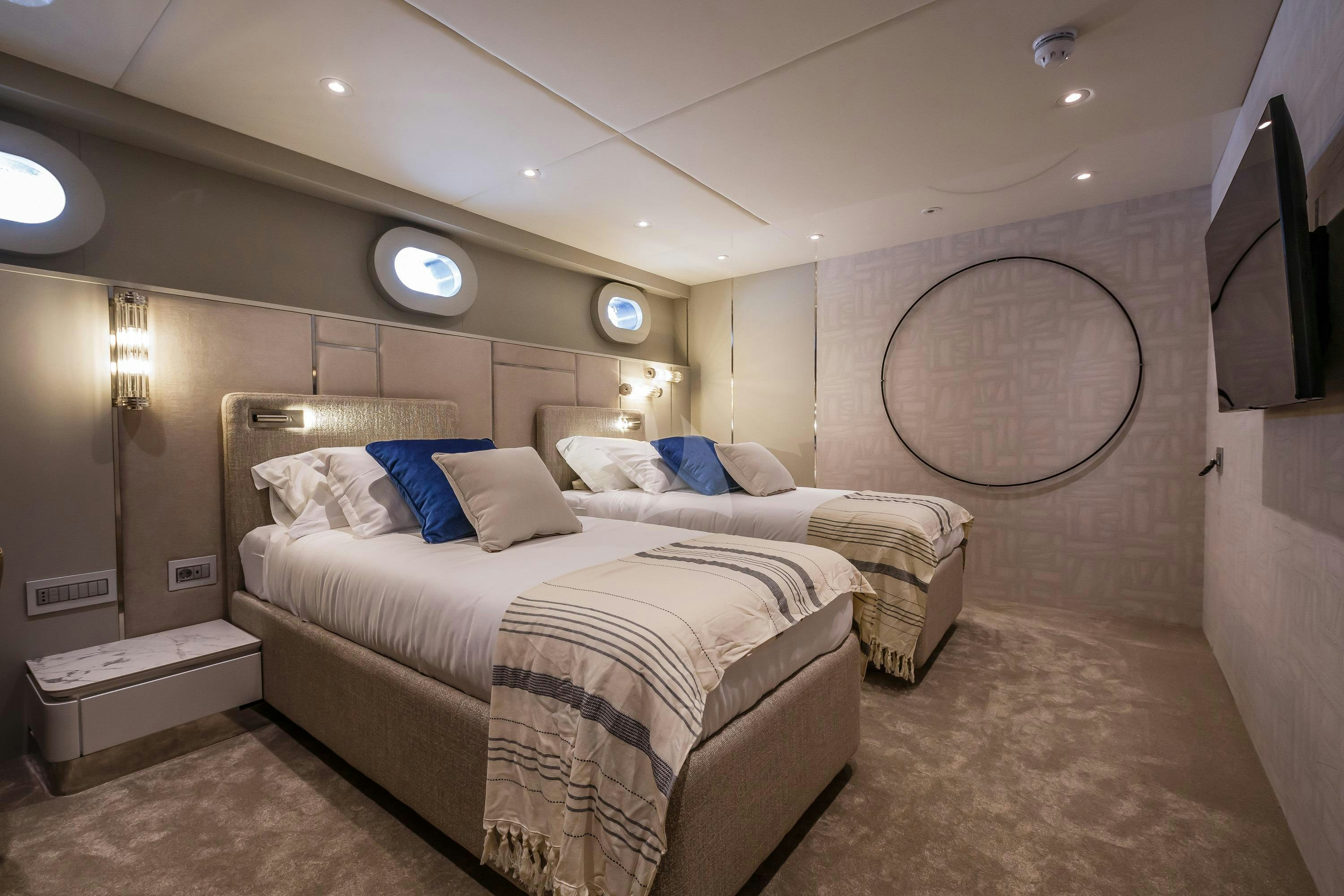 a room with two beds aboard CLASE AZUL Yacht for Charter