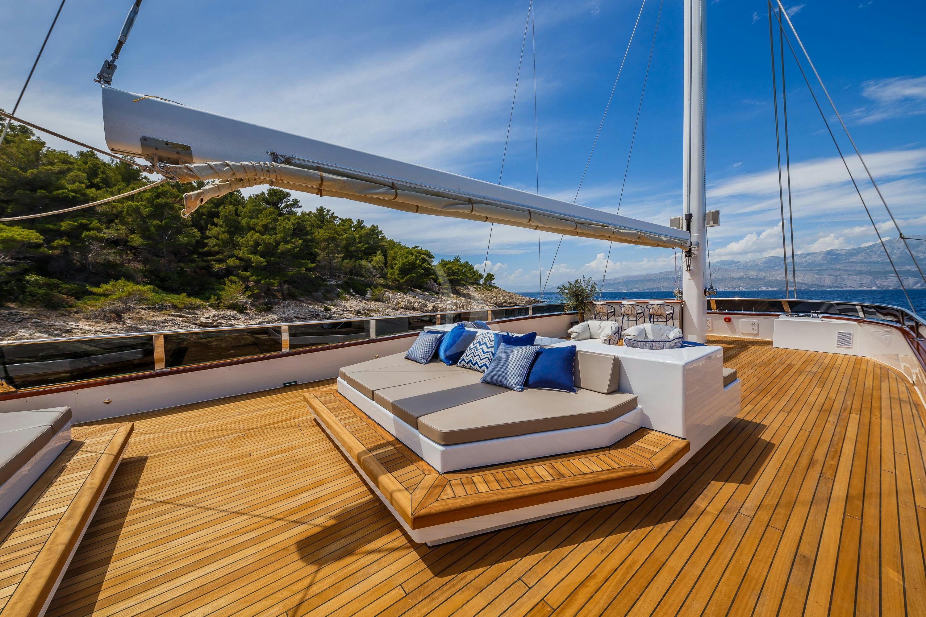 a deck with a view of a city and water aboard CLASE AZUL Yacht for Charter