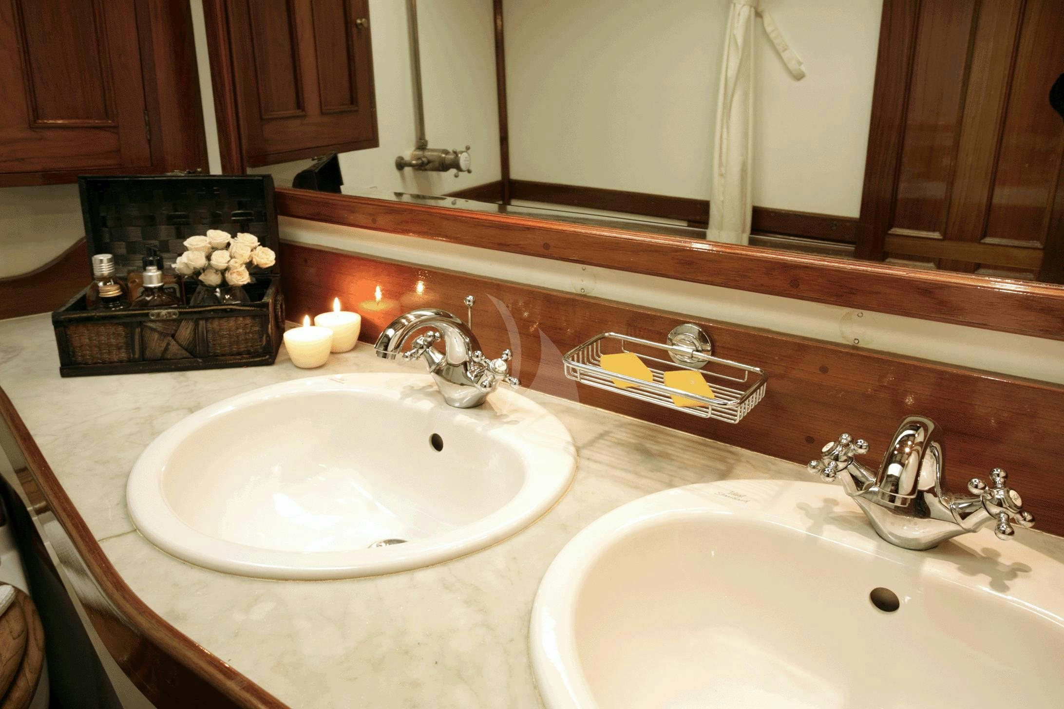 a bathroom with two sinks aboard AELLO Yacht for Charter
