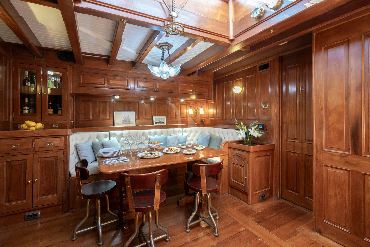 a kitchen with wooden cabinets aboard AELLO Yacht for Charter