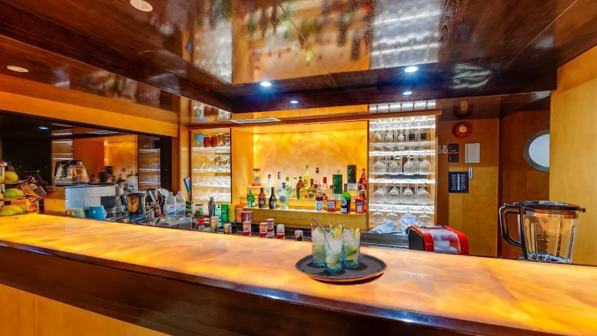 a bar with a glass of beer aboard LIFE IS GOOD Yacht for Charter