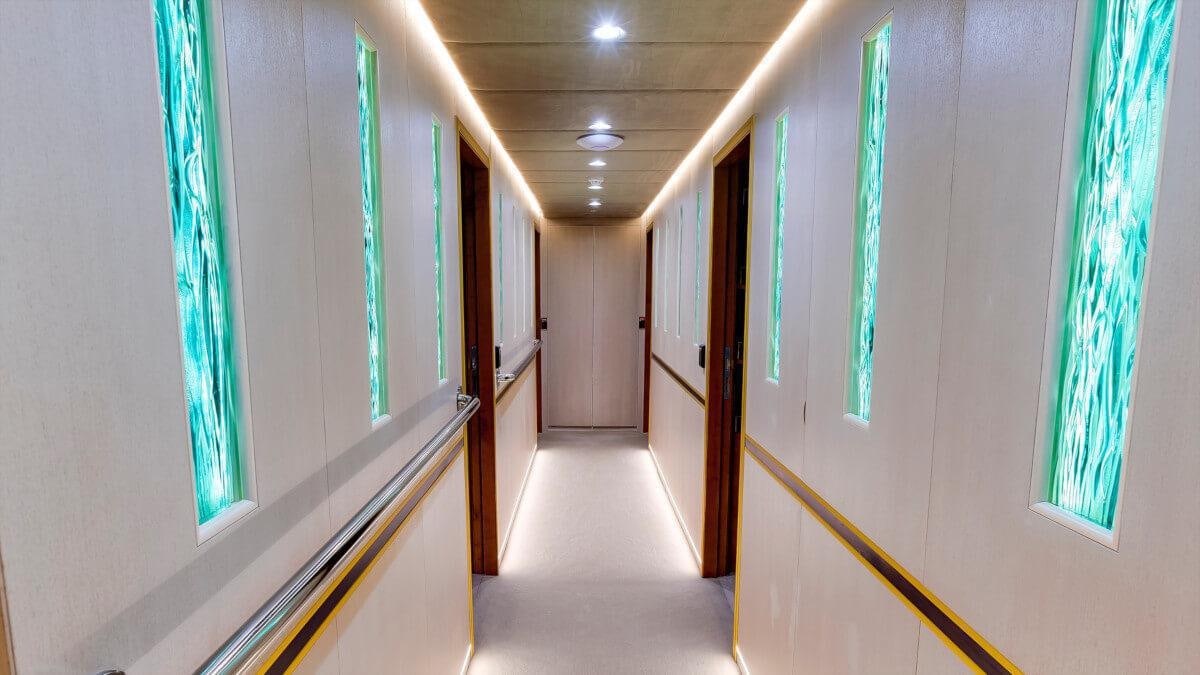 a hallway with white walls aboard LIFE IS GOOD Yacht for Charter