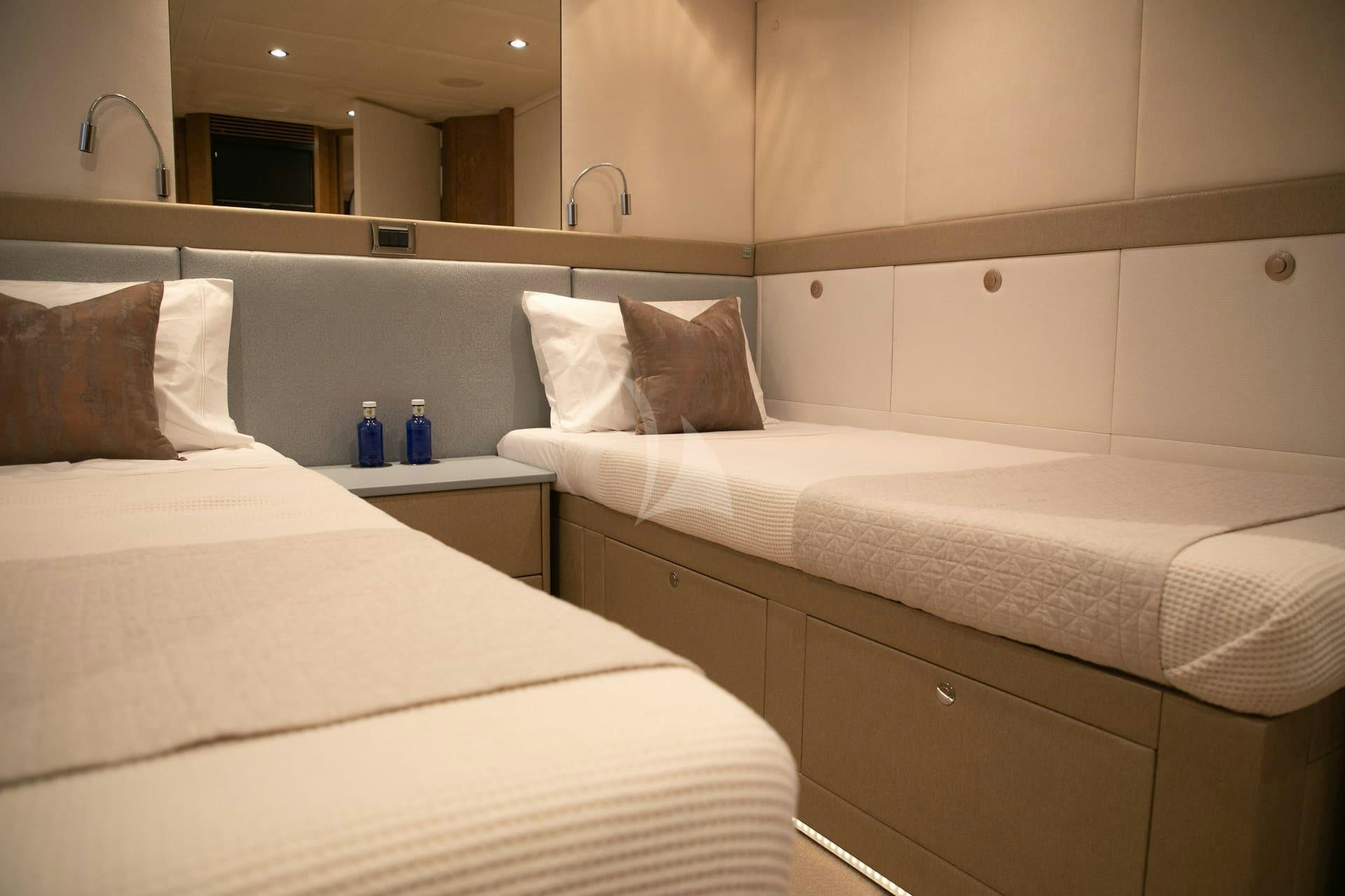 a couple of beds in a hotel room aboard BENITA BLUE Yacht for Charter