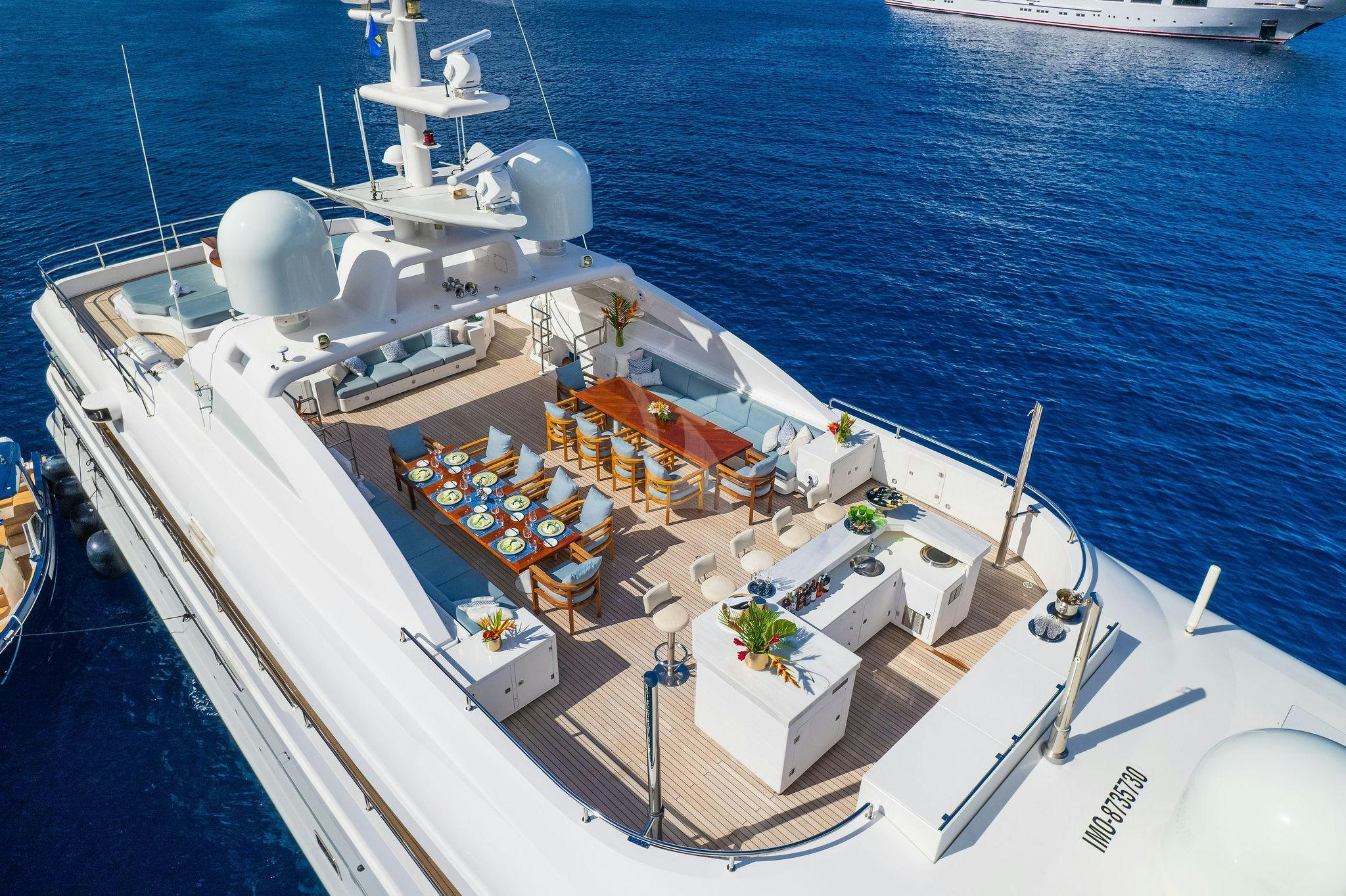 a large ship with a lot of boxes on it aboard OCEANOS Yacht for Charter