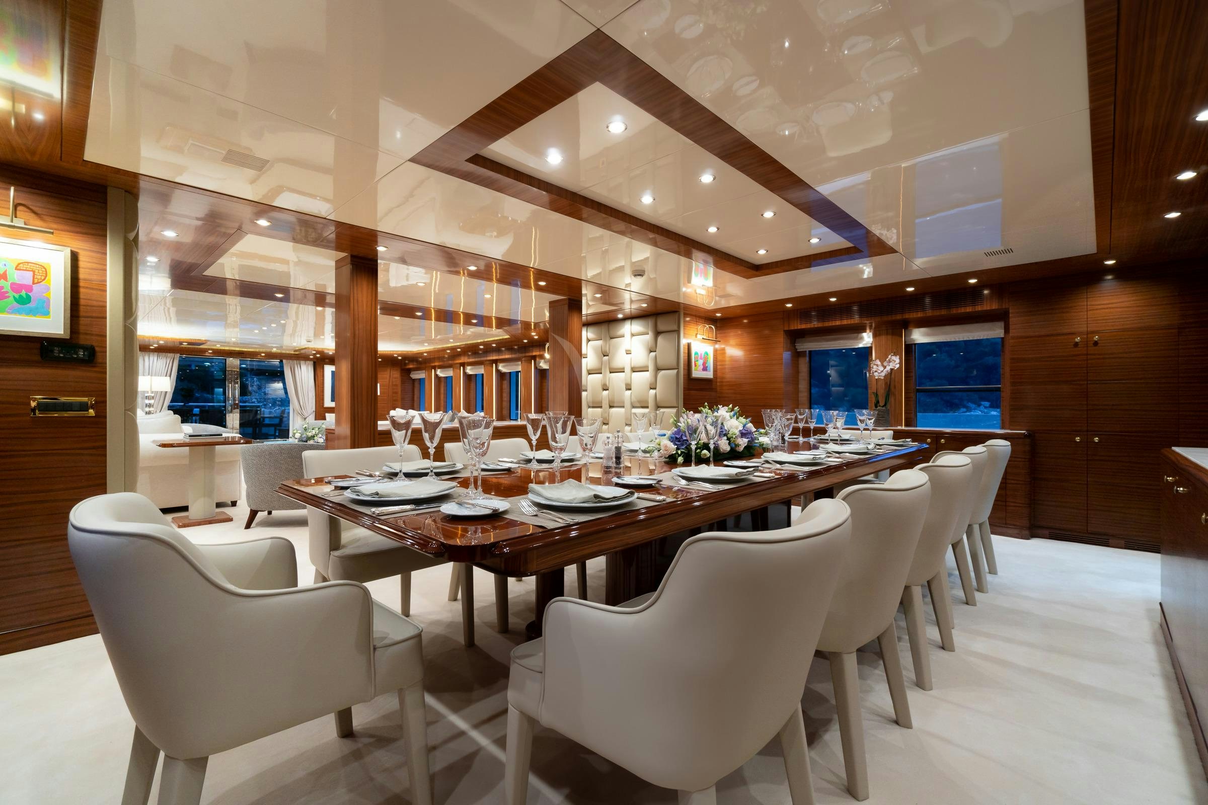 a large dining room with tables and chairs aboard OCEANOS Yacht for Charter