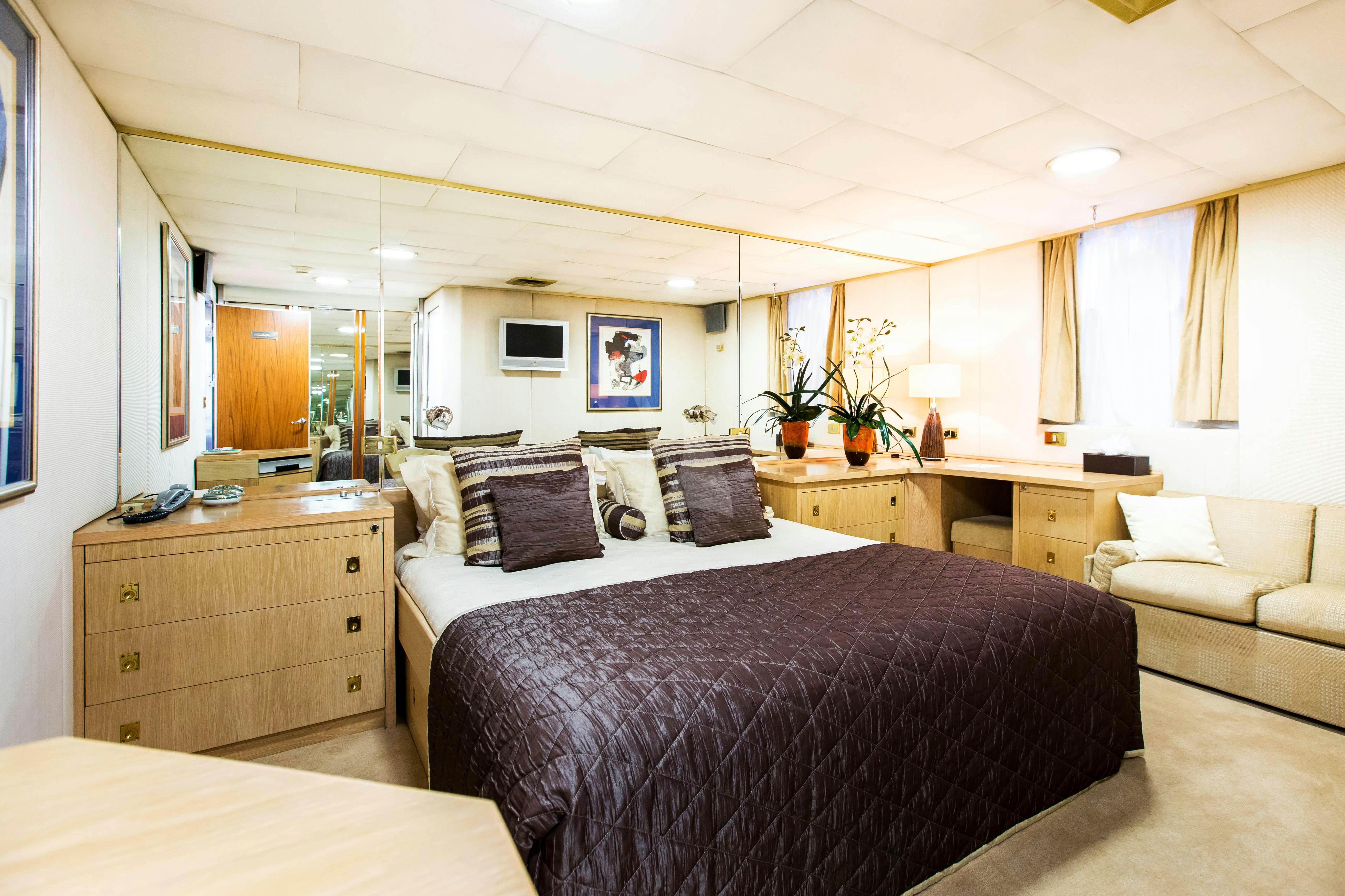 a bedroom with two beds aboard ESMERALDA Yacht for Charter