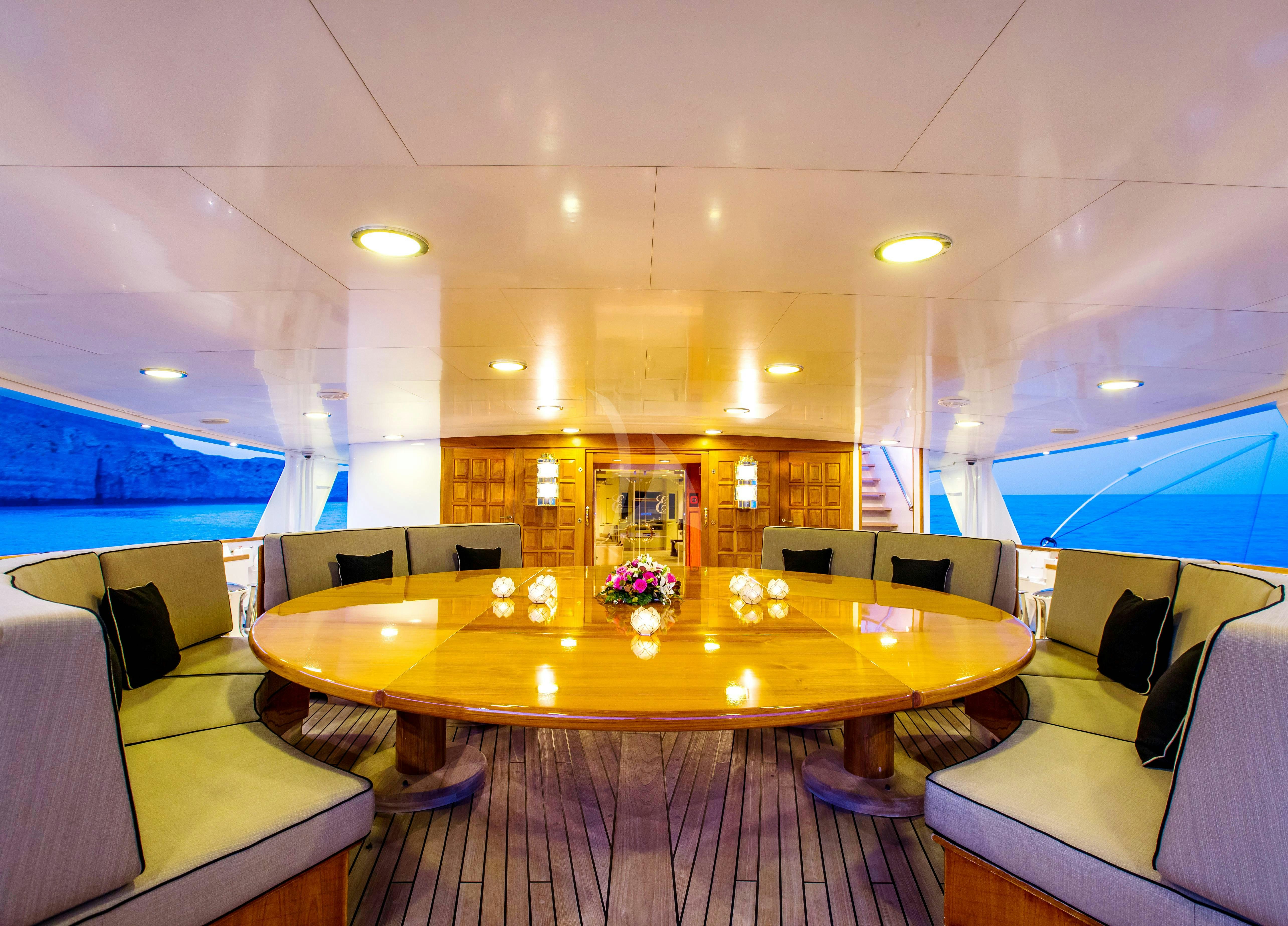 a room with a table and chairs aboard ESMERALDA Yacht for Charter