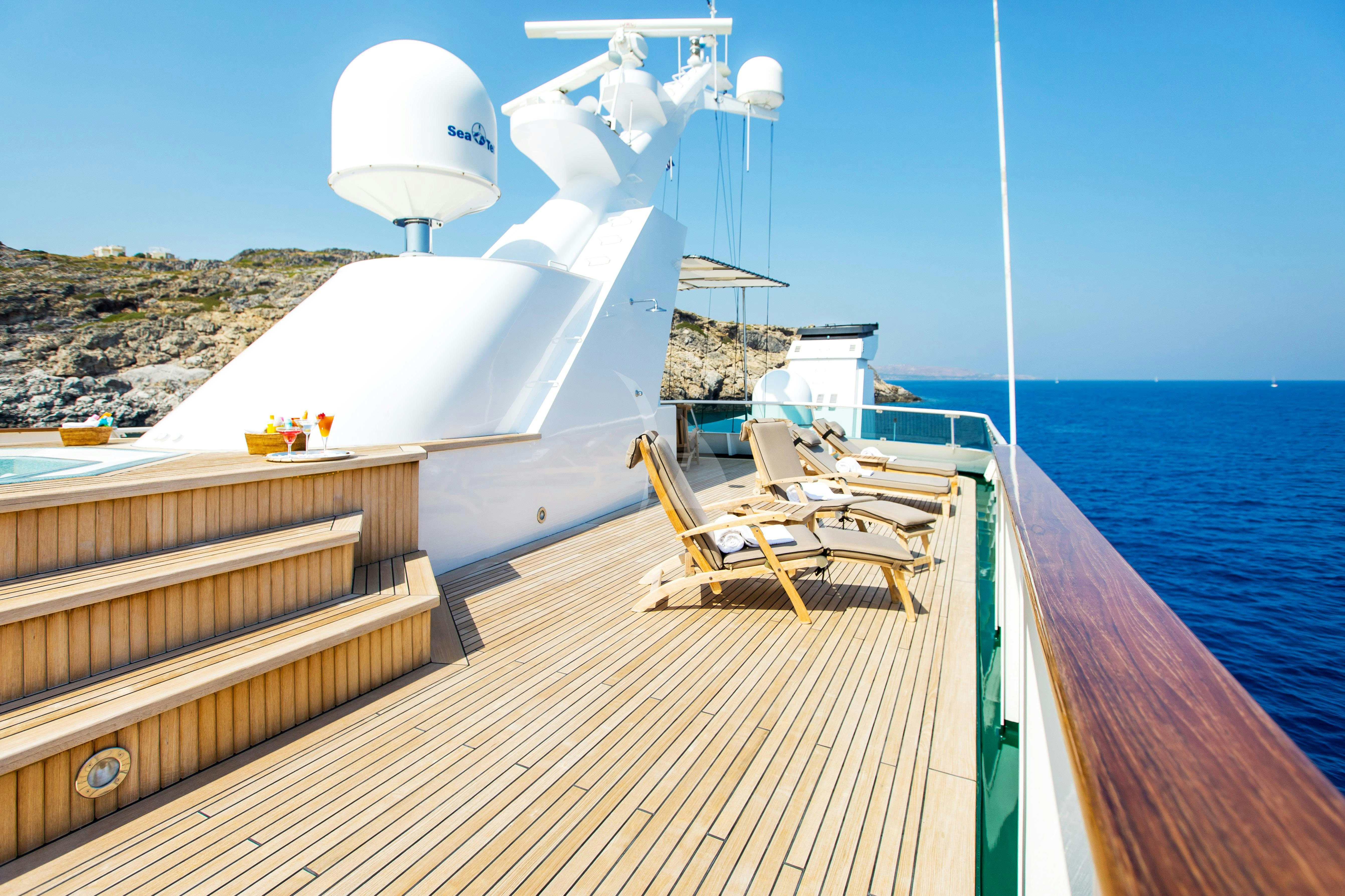 a deck with a large wind turbine aboard ESMERALDA Yacht for Charter