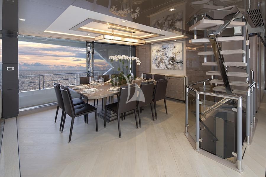 a room with a table and chairs aboard ENTREPRENEUR Yacht for Charter