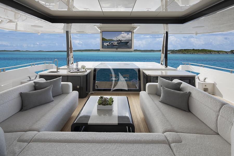 a living room with a large swimming pool aboard ENTREPRENEUR Yacht for Charter