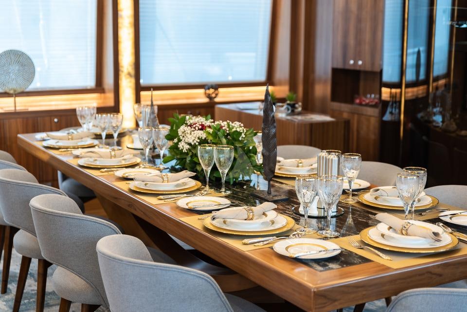 a table set for a dinner aboard ARESTEAS Yacht for Charter