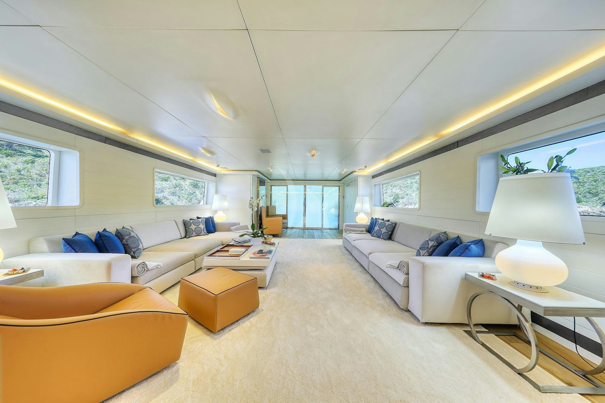 a living room with a couch and a table aboard ANAVI Yacht for Charter