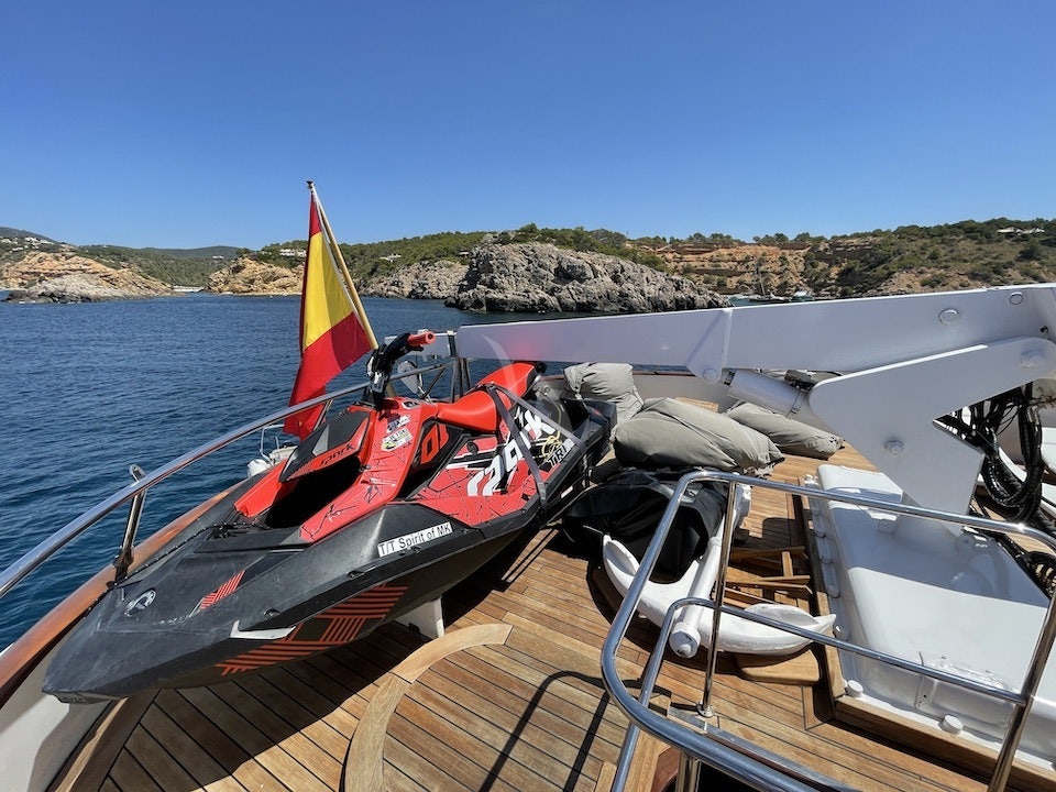 a boat with a sail on the water aboard SPIRIT OF MK Yacht for Charter