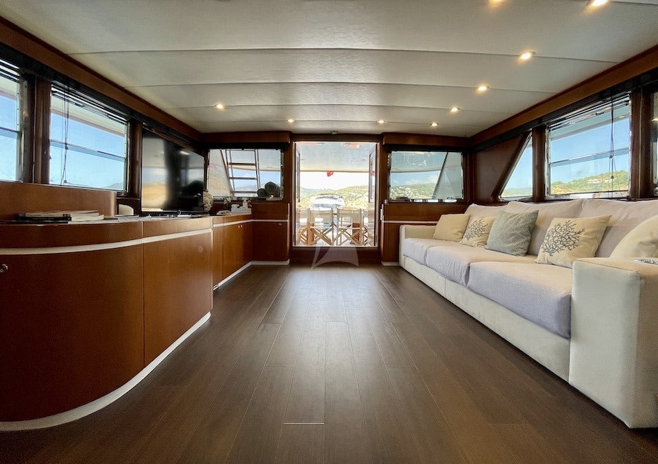 a living room with a large window aboard SPIRIT OF MK Yacht for Charter