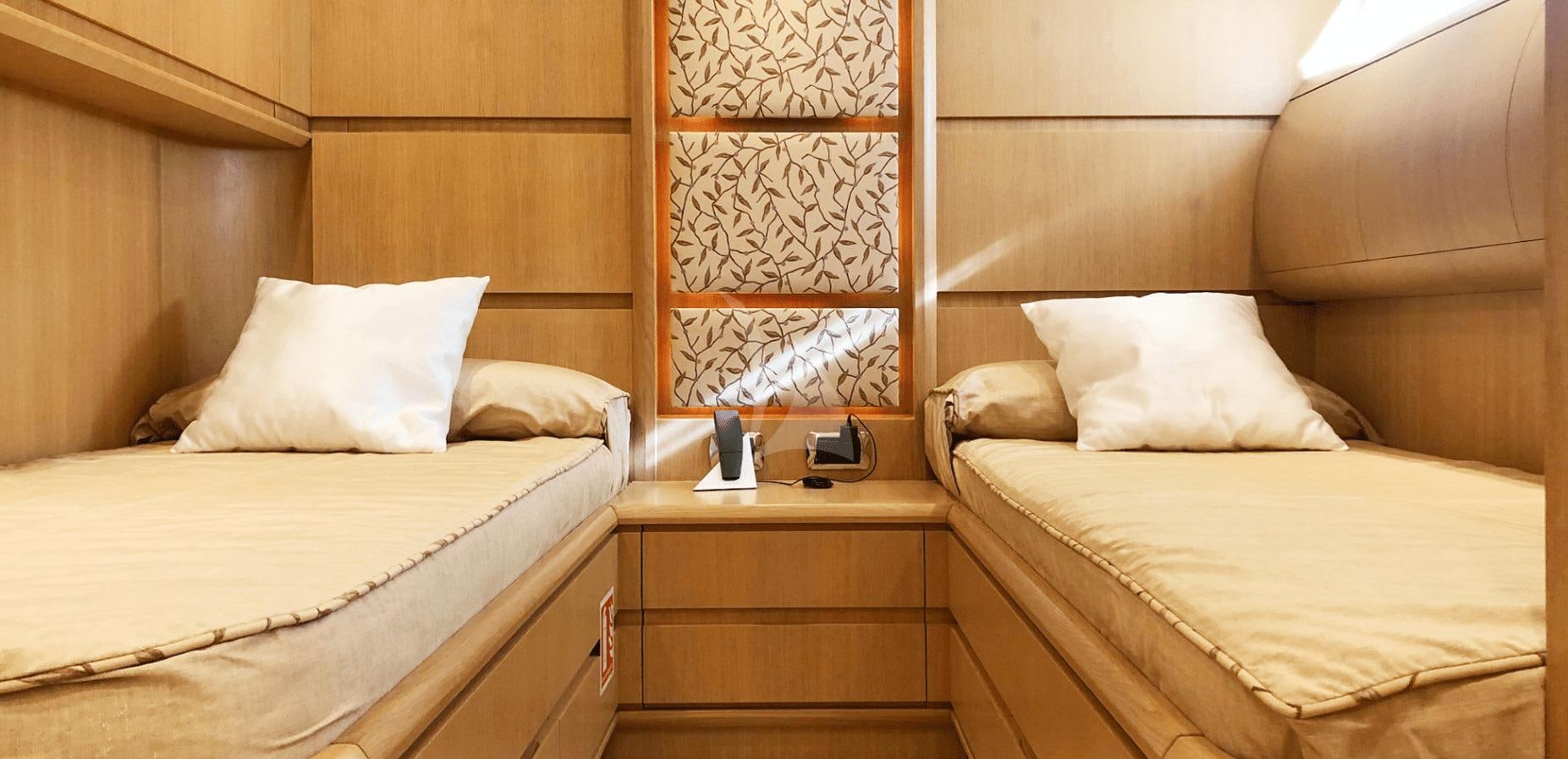 a room with two beds aboard B4 Yacht for Charter
