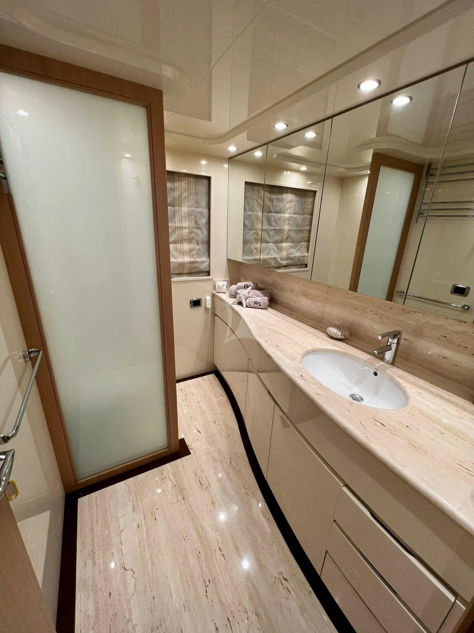 a bathroom with a sink and a mirror aboard B4 Yacht for Charter