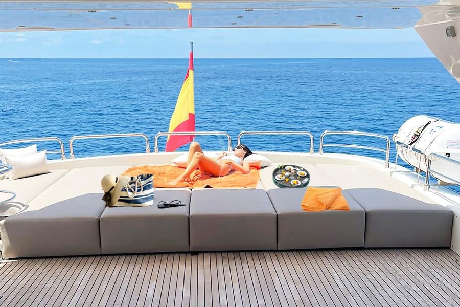 a boat with a sail on the water aboard B4 Yacht for Charter