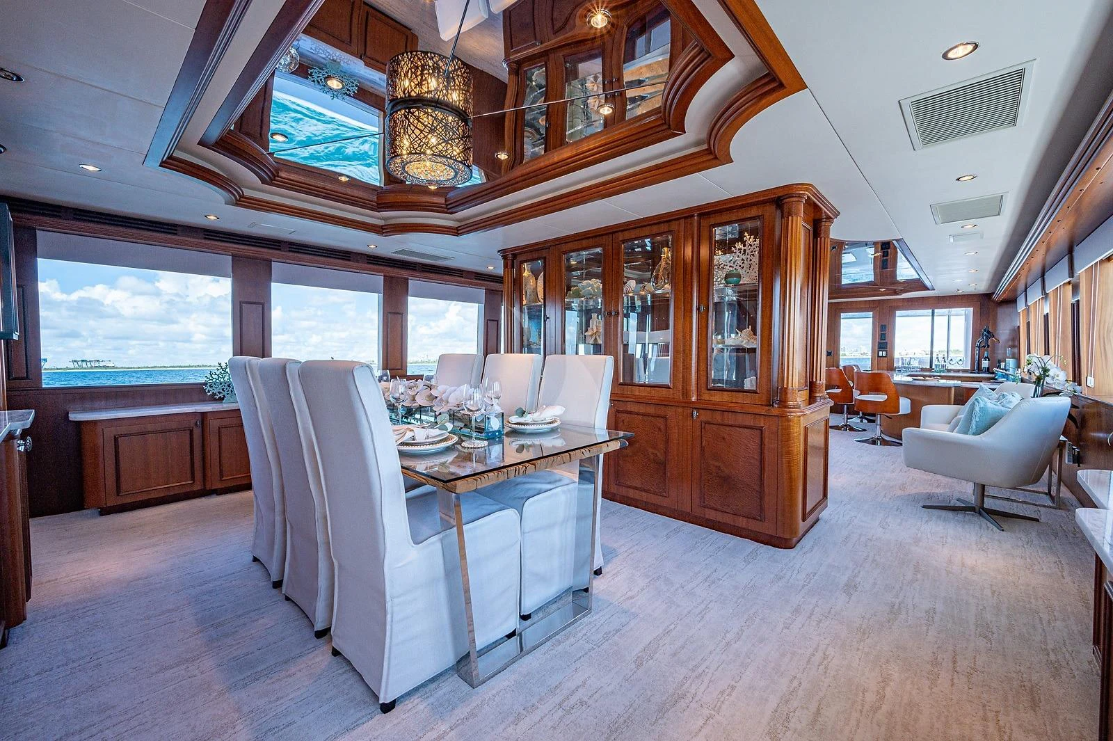 a dining room with a table and chairs aboard MAGNUM RIDE Yacht for Charter